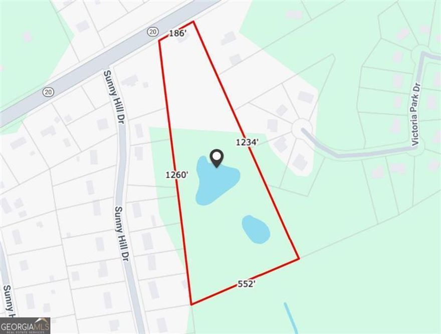 11-Acre Loganville Tract with Pond + Flex Building. Beautiful 11-acre parcel with a mix of open land, pond, and existing 1,600 SF structure. Zoned A2 Agricultural-ideal for small business, recreational retreat, family compound, or long-term investment. Great road frontage on Hwy 20 with 10,000+ daily traffic. Peaceful setting with potential for future growth. Don't miss this rare combination of size, access, and natural features.