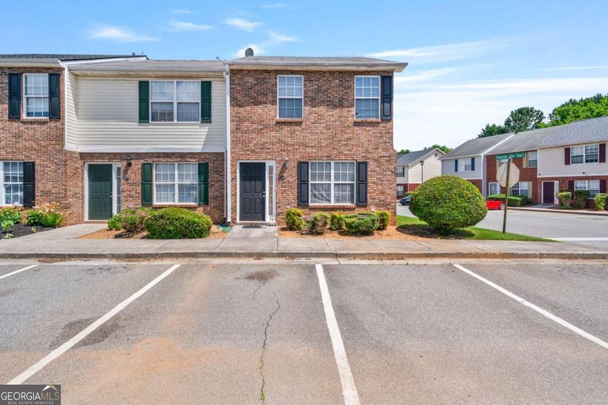 An exceptional opportunity awaits with this well-maintained townhouse, perfectly situated in an established Adairsville community. This property is an ideal fit for a first-time homebuyer stepping onto the property ladder or an astute income-producing investor seeking a dependable asset. This residence is thoughtfully designed with two spacious bedrooms and a highly desirable two and a half bathrooms across 1188 square feet, all on a manageable .05-acre lot that promises ease of ownership and a low-maintenance lifestyle.    The inviting brick and siding exterior welcomes you inside. On the main level, you'll find an intuitive floor plan built for everyday living. The comfortable family room is spacious and bright, offering a wonderful place for relaxation or gathering. Moving toward the back of the home, the practical and functional eat-in kitchen is equipped with ample wood-tone cabinetry, plenty of counter space for meal preparation, and classic white appliances. A dedicated dining area sits adjacent to the kitchen, and a convenient half-bathroom and laundry area complete the main floor.    Ascending to the upper level, you'll appreciate the privacy of the sleeping quarters. Both generously sized bedrooms are true retreats, designed to maximize comfort. Crucially, each bedroom benefits from the privacy and convenience of its own full, dedicated bathroom, making the layout perfect for roommates or a growing family. The bedrooms are easily personalized, with one featuring a cheerful blue accent and the other a calming sage green.    Beyond the interior, the property offers a simple patio area accessible from the kitchen, which extends your living space outdoors for enjoying the beautiful weather. The efficient design, accessible price point, and desirable location in Adairsville-close to local amenities and major routes-make this property a remarkable value. Do not miss this chance to own a great piece of real estate that balances comfort, convenience, and investment potential.