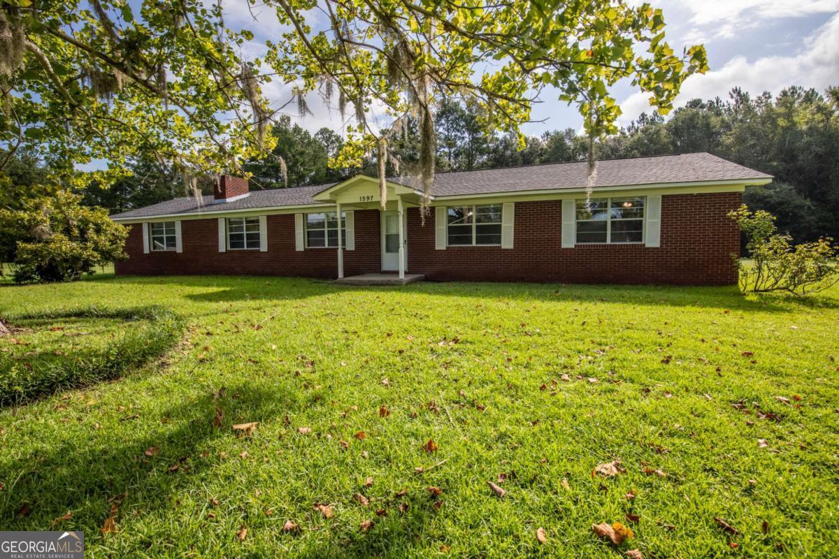 Want to live in the country but not like waaaaaaaay out in the country?? Then this home in Gum Branch is what you've been searching for! Enjoy country living on 2.95ac with ready-to-go chicken coop, partially fenced pasture, stable & workshop within close proximity to Hinesville & Fort Stewart. The spacious all-brick home features 3 bedrooms, great room, den, dining room, roomy kitchen with ample cabinet space, built-in storage in almost every room, crown moulding throughout, interior freshly painted, NO CARPET, an updated bathroom with country inspired single sink vanity, built-in makeup vanity & storage & tile flooring, the other bathroom is completely brand new with LVP flooring, large tiled shower, & over-sized single sink vanity PLUS a 4 yr old roof. Enjoy peaceful sunrises & sunsets without the city noise & buy your new homestead today!