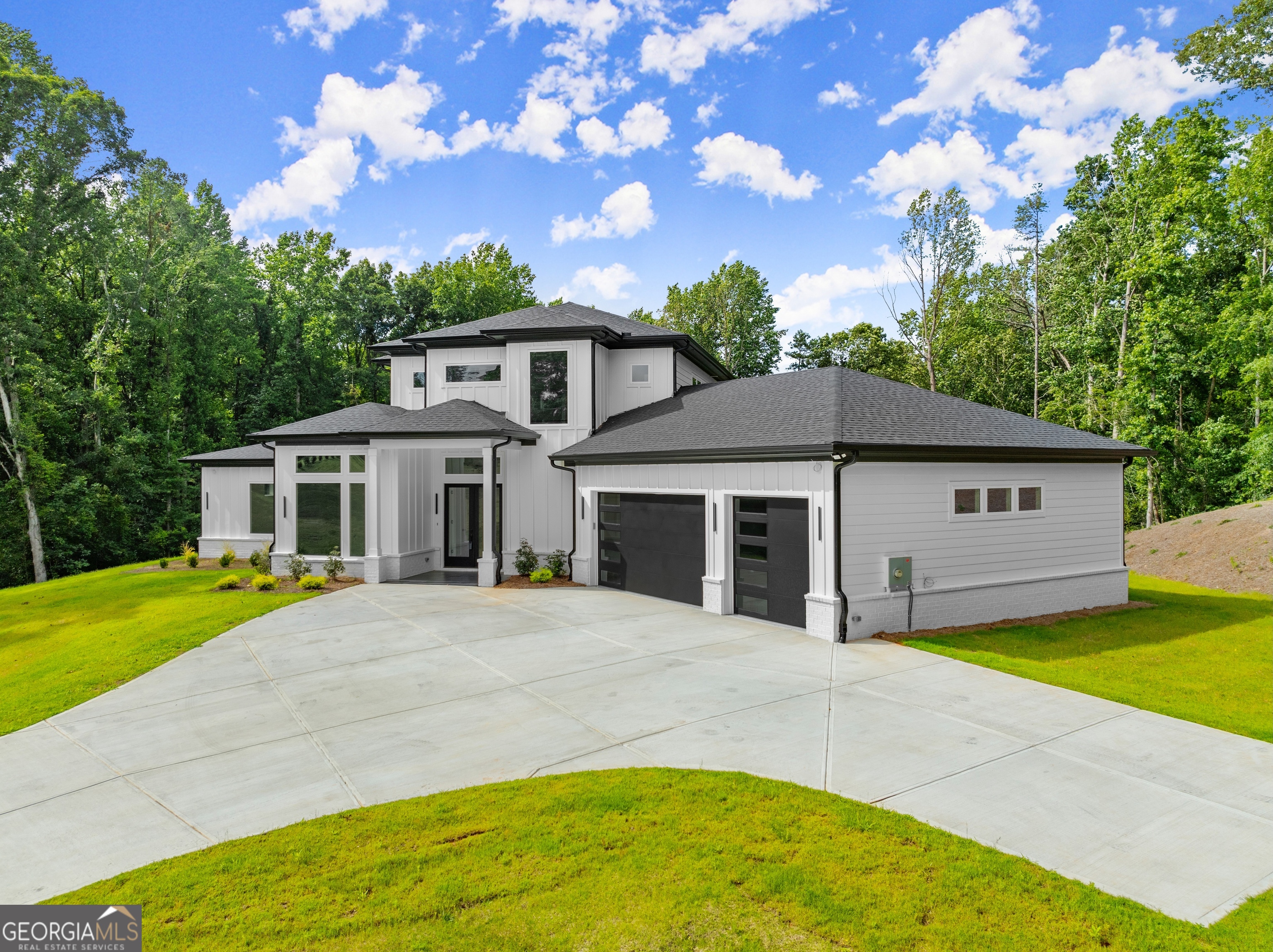 Welcome to your dream home, a stunning custom-built retreat nestled on 3.48 acres of serene, private land. This exceptional property offers the perfect blend of luxury, functionality, and natural beauty, with 2 acres of cleared land and 1.5 acres of wooded tranquility. A long, private driveway leads you to this architectural masterpiece, where every detail has been thoughtfully designed. **Main Level** Step inside to discover a spacious and elegant interior featuring 10 foot ceilings, oversized windows, and an open floor plan flooded with natural light. The heart of the home is the gourmet kitchen, complete with quartz countertops, an oversized island, and a hidden butler's pantry for added convenience. The owner's suite on the main level is a true sanctuary, offering a spa-like en-suite with a curbless master bathroom shower, large custom shower lit niches, and a bidet for ultimate comfort. Additional bedrooms and baths provide ample space for family and guests, each featuring semi-curbless showers, shaving niches, and dimmable shower niche lighting for a touch of luxury. **Secondary Level** Upstairs, you'll find a versatile guest suite with its own sitting room, perfect for hosting visitors or creating a private retreat. **Outside Living** Step outside to enjoy the peaceful surroundings from your tile-front patio, ideal for relaxing or entertaining. The expansive property offers endless possibilities for outdoor activities, gardening, or simply enjoying the privacy and natural beauty of the landscape. **Exceptional Features** Venetian plaster fireplace and vent hood cover for a touch of sophistication. Vessel sinks and instant hot water for modern convenience. Epoxy garage flooring and a three-car garage for ample storage. Garbage disposal and other high-end finishes throughout. THIS HOME IS A RARE FIND, combining luxury, privacy, and functionality in one exquisite package. Don't miss the opportunity to make this custom-built estate your forever home!