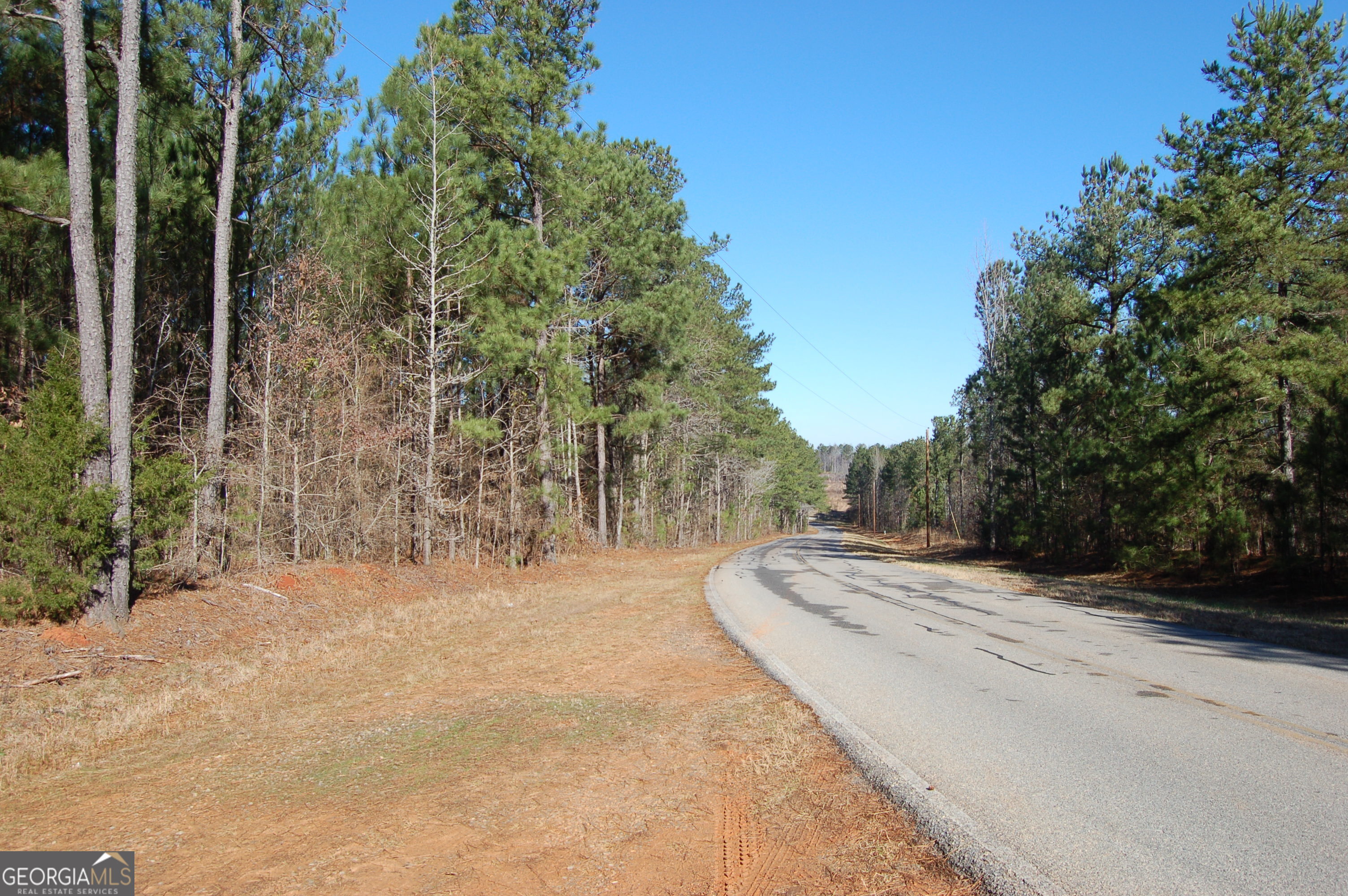 Exceptional investment property located on Fears Road in Morgan County, just 10 miles from Downtown Madison and 2 miles from I-20. This 287.25-acre tract features over 3,200 feet of road frontage, city water access, and electric service. Ideally positioned less than 3 miles from the Rivian EV megasite and Stanton Springs Industrial Park, the property offers unmatched potential for residential, commercial, or industrial development. Walnut Ridge also boasts a 400,000-gallon water tower nearby and favorable soil evaluations. Gently rolling topography, proximity to parks, and strong economic drivers-including Rivian's $5B facility-make this a high-upside land investment.