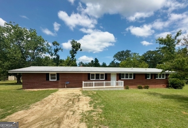 Remodeled Move-In Ready Brick Home - 4 BED 2 BATH on 6.83 ACRES - Beautiful Oak Harwood Floors - Spacious Den Connected To Kitchen - New Appliances, Light Fixtures and Paint - Brick Fireplace - Double Car Carport - Outstanding Metal, Foam Insulated Barn/Workshop - Large Open Backyard - Pecan Trees - Fruit Trees -