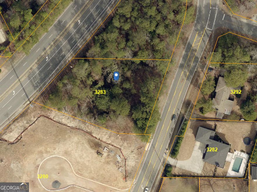 Great lot In East Cobb with double road frontage shared with Sandy Plains Road.   Lots of possibilities for this acreage.   Topography is very good on this buildable lot.