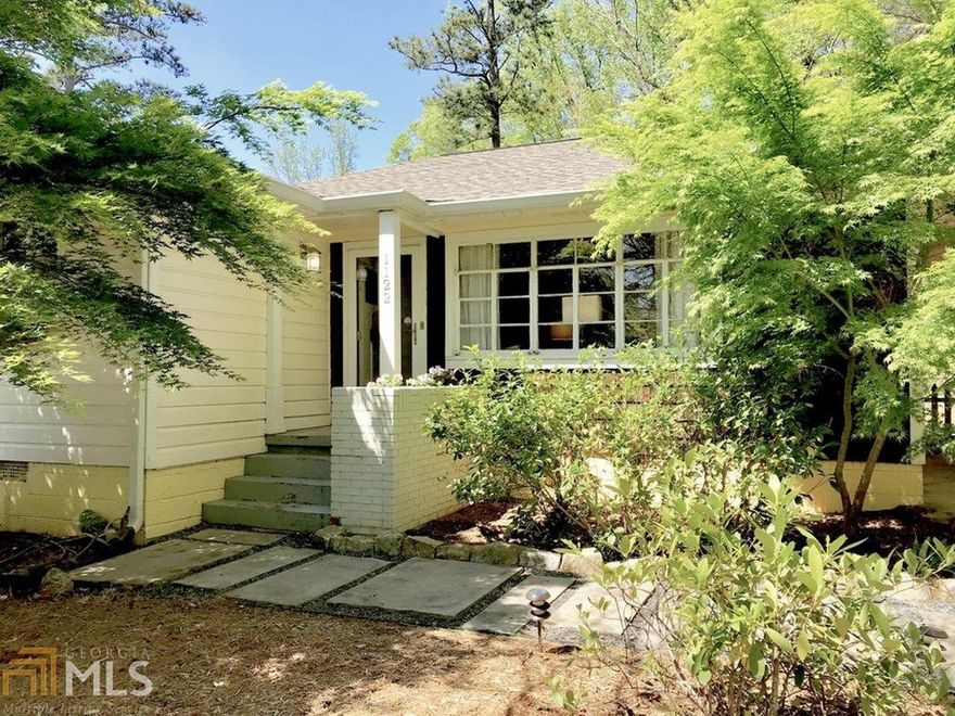 Built in 1950, this completely unique Cottage straddles an interesting architectural line merging the sensible flow of a Classic Post-War Bungalow with the vintage thrills of a Mid-Century home. Huge banks of windows fill the rooms with sunlight, offering views of the lovingly and lushly landscaped oversized lot. Sitting sweetly on a crest, the home's placement atop a small rise from the street creates a lovely sense of privacy and living amongst the trees. When you're all tucked away in your charming mountain-like pad it's easy to forget the excitement of living in beloved East Atlanta Village, one of the most dynamic and happenin' of Intown Atlanta n'hoods. Welcome home, friend!