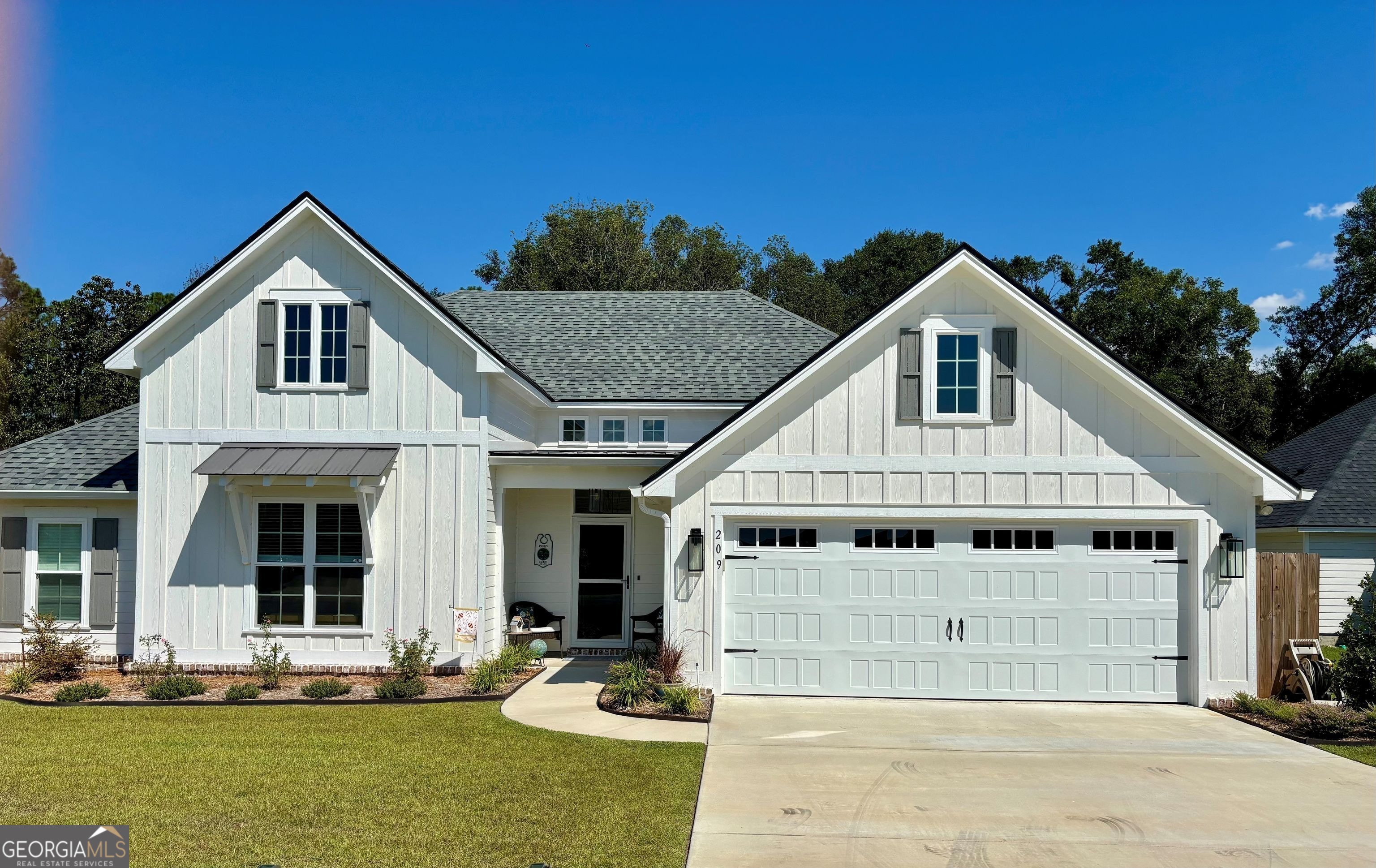 Why wait for new construction when you can have better than new right now? Tucked away at the back of the desirable McNeal Estates community and backing to serene woods, this Dixon Taylor Construction home blends thoughtful finishes with a modern, livable design-now enhanced by a brand-new (2024) saltwater gunite heated and cooled pool. Inside, the open floor plan highlights a chef-friendly kitchen with a large island, custom granite countertops, stainless steel appliances, large pantry with wooden shelves, and abundant cabinet and counter space for meal prep or entertaining. The dining area flows seamlessly to a screened patio overlooking the sparkling in-ground pool with a tanning ledge and surrounding privacy panels. In the living room, exposed wood beams create a warm, welcoming atmosphere. A spacious mudroom/laundry area with extra cabinetry and cubbies keeps household essentials neatly organized. The luxurious primary suite offers a coffered tray ceiling, relaxing soaker tub, oversized tile shower, dual vanities, and a generous walk-in closet. Located just minutes from Hahira Elementary and Middle School and zoned for Lowndes County Schools, this home is also close to Hahira's charming town center-home to community festivals, local shops, and restaurants.