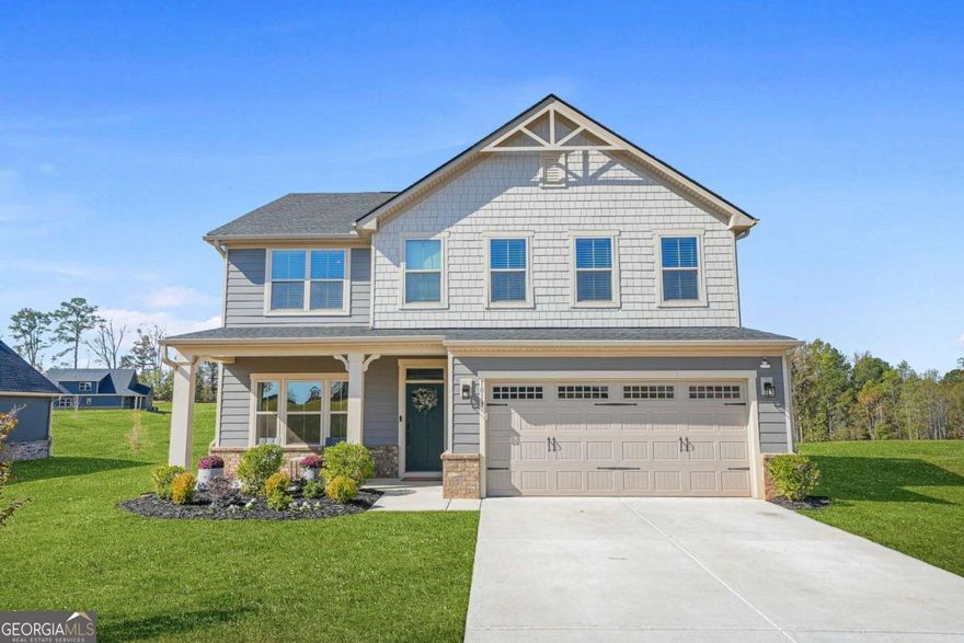 Welcome to 1013 Climbing Rose Way - a beautifully designed home where modern elegance, comfort, and thoughtful upgrades come together seamlessly.  Located in one of McDonough's most desirable communities, this 4-bedroom, 3-bath residence offers the perfect blend of style and functionality, just minutes from I-75, South Point Shopping Center, and local dining and entertainment.  Step inside to discover an open, light-filled main level featuring a flexible library or home office, along with a bedroom and full bath-ideal for guests or multi-generational living. The chef's kitchen is a true centerpiece, showcasing two-tone cabinetry, quartz countertops, a designer tile backsplash, an upgraded vented range hood, and enhanced lighting that beautifully highlights the space. Elegant hardwood flooring extends through the living areas, complemented by soft, coordinated carpeting for added warmth and comfort.  Upstairs, the spacious owner's suite offers a private retreat with a Roman-style shower, dual vanities, and abundant natural light. Two additional bedrooms, a bonus media room, and an extra flex room provide endless possibilities for a playroom, home gym, or creative space.  Additional enhancements include custom window treatments, Levolor blinds, and professional-grade interior paint throughout. The garage features finished drywall, fresh paint, and epoxy-coated floors for a clean, polished finish. Outdoors, the upgraded front landscaping and rear yard with paver installation for a grill station and concealed trash storage area create a low-maintenance, high-style outdoor living experience.  With over $45,000 in thoughtful upgrades, every detail has been selected for quality, comfort, and lasting appeal - making this home truly move-in ready and one-of-a-kind.  Experience the perfect balance of luxury and livability at 1013 Climbing Rose Way - schedule your private tour today!