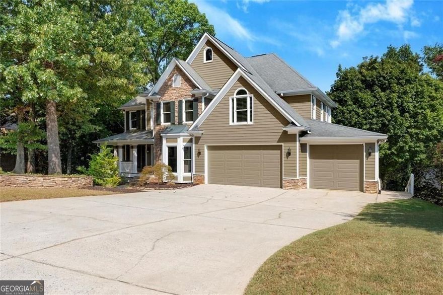 Incredible NEW PRICE on this impeccably maintained Hardage Farm showstopper with awe-inspiring Kennesaw Mountain views! Perfectly situated on a cul-de-sac lot in the highly desirable West Side Elementary School District, this move-in ready home features 4 bedrooms, 3.5 baths, and a full finished daylight basement. Recent upgrades include a brand-new HVAC, new water heater, fresh landscaping, new carpet and paint.  Step inside to find gleaming hardwood floors and a soaring two-story fireside great room. The chef's kitchen impresses with custom Thomasville cabinetry, Wolf gas range and hood, paneled appliances, and luxurious granite counters. Upstairs, four bedrooms offer plush carpet, custom Elfa closets, and glorious mountain views. The primary retreat boasts a renovated bath with dual marble vanities, soaking tub, and separate shower.  Enjoy multiple outdoor living spaces - two decks, a screened porch, and a covered patio - all designed to take in the breathtaking scenery of Kennesaw Mountain National Park. The finished terrace level expands the living space with a full bath, kitchenette, private bar, optional 5th bedroom, recreation area, and family room. Neighborhood amenities include a clubhouse, pool, tennis, pickleball, playground, and fishing pond, plus direct access to Kennesaw Mountain Battlefield Trails. Minutes to Marietta Square, Marietta Country Club, and The Avenues. Live your best Marietta lifestyle today!