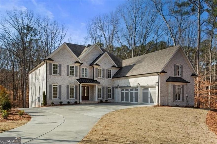 Stunning custom built, 4 sided brick home in the heart of Milton. Located on a wooded and very private cul-de-sac lot, this home features multi-car parking with oversized three car garage on main level and additional 3 car garage with driveway access on terrace level. The impressive two story entry welcomes you to a well appointed great room with (finished on site) hardwood flooring, and warm fireplace. The chefs styled kitchen offers abundance of custom cabinetry with quartz counter tops, and professional grade appliances. Don't miss the sizeable walk-in pantry. The kitchen has open views of a natural lighted breakfast area, and a vaulted keeping room with a cozy fireplace. In addition to a convenient guest suite on main level, this house also features a luxurious and sizeable owners suite with walk in closet and custom shelving all on the main level. Bring the kids! The 2nd floor features four secondary bedrooms all with ensuite baths and walk in closets. One secondary bedroom features its own secret playroom... a must see! A second and very impressive primary owners suite is located on 2nd floor. This suite also includes a luxurious bath and a massive walk in closet with custom shelving. This custom built home is truly unique and a rare find for that special family.