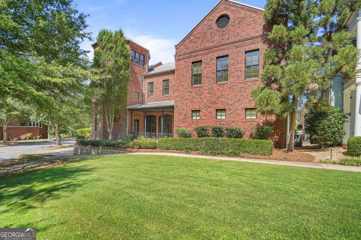 Dream Home in Covington's Premier Upscale Neighborhood! Welcome to the dream lifestyle in one of Covington's most prestigious and sough after communities-just minutes to the Covington Square and convenient access to I-20. This exclusive, golf-cart-friendly neighborhood offers charming sidewalks, vintage-style streetlights, and a community park with a playground and ball field, perfect for enjoying the outdoors with family and friends. This stunning all-brick, 5-bedroom, 5.5-bath estate blends timeless elegance with exceptional function and design. Step inside the grand, two-story marble foyer, accentuated by a breathtaking chandelier and bathed in natural light from expansive windows throughout the home. The heart of the home is a professional-grade chef's kitchen, featuring top-of-the-line commercial appliances, a large food prep island, and a massive breakfast bar island with built-in microwave, secondary sink, and seating for six or more. Just off the kitchen, you'll find a climate-controlled wine cellar with a stunning barrel ceiling-perfect for entertaining or unwinding in style. The open-concept great room includes both a dining area and spacious living space with a classic fireplace, flanked by elegant French doors offering a grand view of the inviting front porch and pool area. The owner's suite is truly a retreat, with a beautiful double tray ceiling, two-way fireplace shared with the adjacent study/library, and an exquisite ensuite bath. Enjoy a steam shower, dual vanities with rich wood cabinetry, a whirlpool tub with a fireplace view, and his and hers cedar-lined walk-in closets. Upstairs, you'll find three spacious secondary bedrooms, including a Jack-and-Jill layout with individual vanities, and one with its own private bath. The third-floor rotunda provides a panoramic circular view-ideal for a reading nook, art space, or additional office. Entertainment is elevated with a fully appointed home theater, complete with custom woodwork, surround sound, dry bar, and powder room. The resort-style pool area features a covered outdoor kitchen and ample space for lounging or hosting unforgettable gatherings. Car enthusiasts will appreciate the two garages: a two-car garage with a bonus room above and a three-door garage equipped with two hydraulic lifts, offering space for up to five vehicles. Above the three-car garage is a wonderful apartment that can be an in-law's suite or rental space. This extraordinary home delivers sophistication, comfort, and luxury in one of Covington's most coveted communities. Schedule your private tour today and experience the lifestyle you've always imagined.