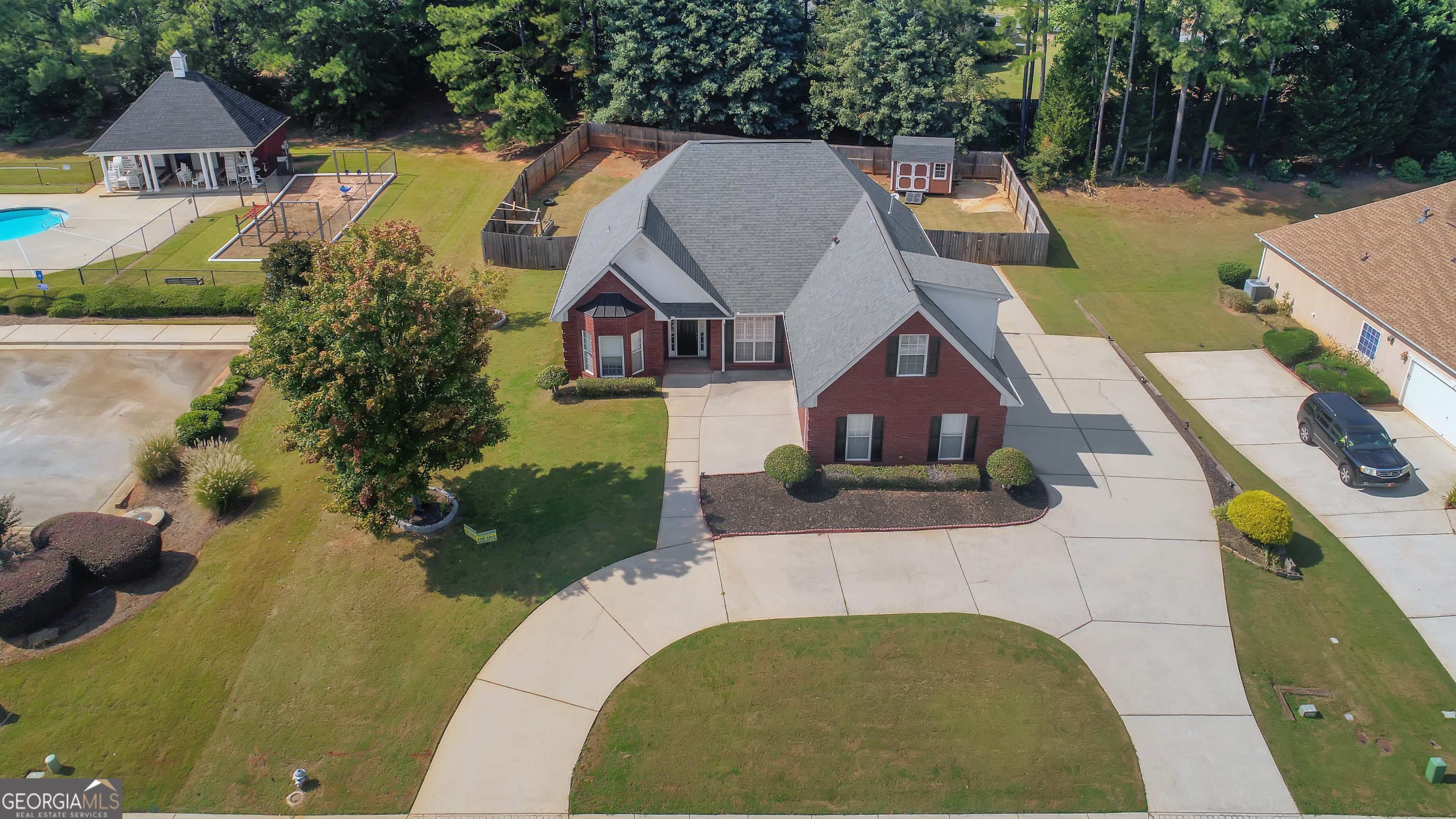 WELCOME HOME to your beautiful all brick home located in the heart of Henry County. This property has all kinds of upgrades. All Brick exterior, 3 entrance Doors, Circular Driveway, Fenced Backyard, Private wooded area adjacent, Community Pool next door, Hardwood Floors, Trey Ceilings in several rooms, Kitchen Granite Countertops, New Stainless-steel appliances, Wood Window Blinds and more! Walk in the front door to the Foyer that looks into the Dining Room, and both look into the Living Room with Trey Ceiling, Brick Fireplace, Picture windows that look out to the backyard Pergola and Fenced yard with garden and Large Outbuilding to store the Lawn Equipment. The Kitchen also looks out the backyard and features a new Stainless Steel Gas Range and top of the line Stainless Steel Whirlpool Dishwasher. The Breakfast area offers bar stool seating as well as a sit-down table area. The Laundry Room is across the hall with a Washer and Dryer in place. Continue through the Laundry and enter the oversize attached Garage with Auto Door Opener. A side door reaches additional concrete parking and a double gate fence with space to drive through. The home is styled with a Split Bedroom Plan. The Master Bedroom is on one end of the home and is private with French Doors to the Back yard. You'll love the Master Bath with Separate Shower and Jetted Tub. Double Sink Vanity and granite counters with lots of space. The Walk in Closet will hold all the wardrobe. On the opposite end of the house the 2 secondary bedrooms are separated by a Full Bath with Shower Tub combo. Possible 4th Bedroom is upstairs over the garage. Lots of space for the kids, playroom or office. New Gas Water Heater and HVAC unit provide additional value with this purchase. Located near Eagles Landing First Baptist Church and School. This home is a great place to settle in POPULAR HENRY COUNTY. Call today for your personal tour!