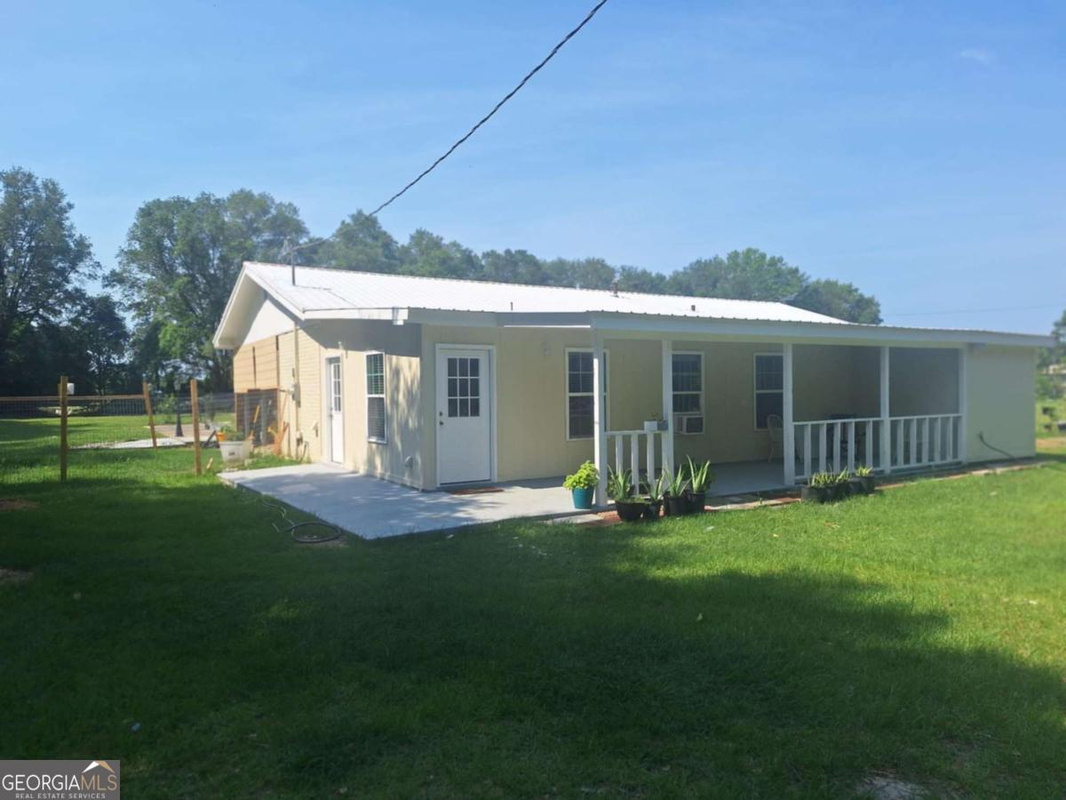 Beautiful 3 bed/2.5 bath w/2.22 acres offer space and convenience. This home has plenty of indoor comfort w/expansive outdoor area perfect for relaxing or entertaining. Just finished renovating: new bathrooms, ac unit for main house and split unit for sunroom, paint interior/exterior, electric panel, 700 sq addition w/kitchen and cabinets, new dryer, kitchen faucets, bedroom lvt, and concrete around the house. Kitchen appliances and washer/dryer included. Everything has been taken care of and ready to move in!! Very quiet area close to the schools, Walmart and restaurants. Easy access to US #1 or Hwy 15. Enjoy your coffee on the front porch watching the sunrise and the back porch sunsets. Plenty of room for outdoor activities or make your own garden. Give us a call today 912 286 7292 or 912 705 7084.