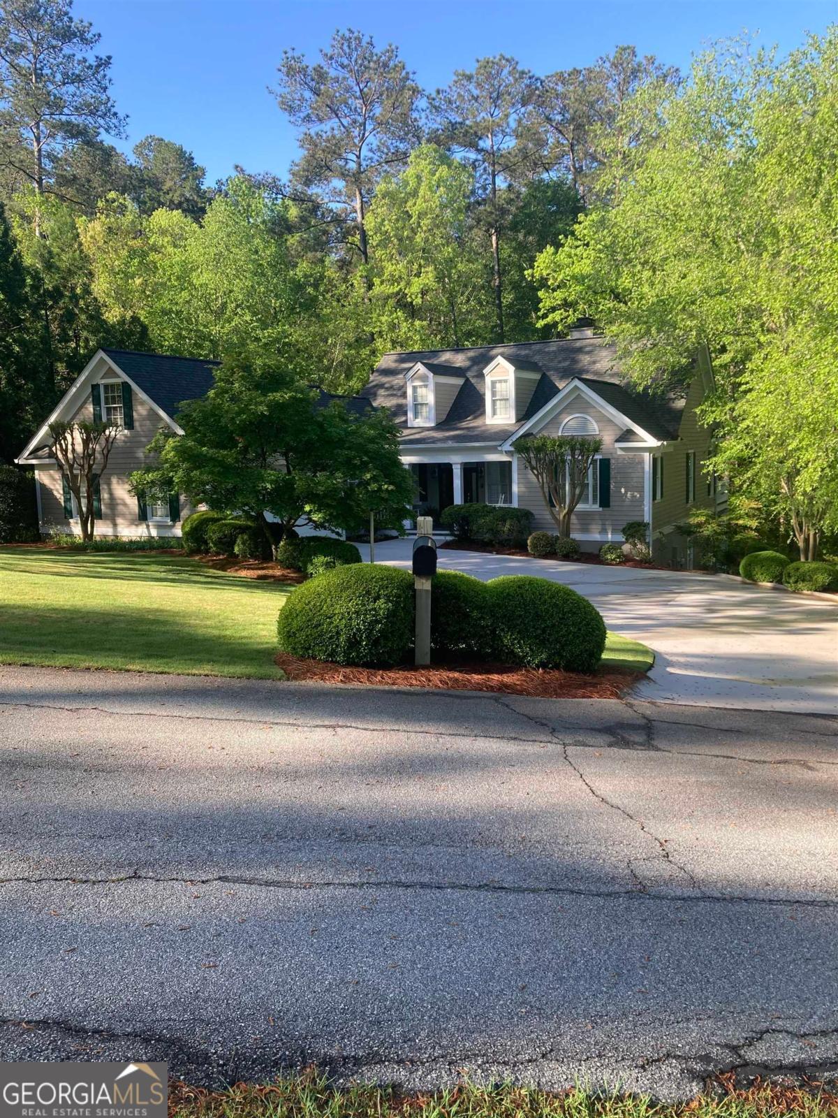 WELCOME TO 1020 TROUBLESOME CREEK LANE. THIS CHARMING LAKE ACCESS HOME IS LOCATED ON A QUIET CUL DE SAC IN THE PARROTTS COVE SECTION OF REYNOLDS LAKE OCONEE. IT IS A PERFECT LOCATION ON THE RICHLAND CREEK SIDE OF THE LAKE WITH EASY ACCESS TO ALL THE AMENITIES REYNOLDS HAS TO OFFER INCLUDING GOLF, FITNESS, TENNIS, PICKLEBALL, WALKING TRAILS AND RESTAURANTS. THE MAIN LEVEL FEATURES AN OPEN FLOOR PLAN WITH LIVING, DINING AND KITCHEN WITH BREAKFAST NOOK. THE GRILL DECK IS RIGHT OFF THE KITCHEN. IN ADDITION TO THE OPEN LIVING AREA, THERE IS A WONDERFUL SUNROOM ACROSS THE BACK OF THE HOME AND A OPEN DECK AREA. BOTH ARE PERFECT OPTIONS FOR MORNING COFFEE IN A QUIET TRANQUIL WOODED SETTING WITH BROOK. THE PRIMARY BEDROOM WITH ENSUITE IS ON THE MAIN LEVEL AS WELL. THE LOWER LEVEL WALKOUT OPENS TO A DEN WITH FIREPLACE. AN ADDITIONAL LARGE FLEX ROOM WITH CLOSET AND HIGH WINDOWS PLUS 2 QUALIFYING BEDROOMS, 2 BATHS AND A STORAGE ROOM COMPLETE THE SPACE. THE OUTDOOR LIVING AREA ON THE LOWER LEVEL IS AN UNDERCOVER TERRACE. SELLER HAS JUST HAD MAIN LEVEL HARDWOOD FLOORS REFINISHED AND NEW CARPET IN THE PRIMARY BEDROOM. NEW ROOF WAS DONE IN 2025. A GOLF MEMBERSHIP IS AVAILABLE.