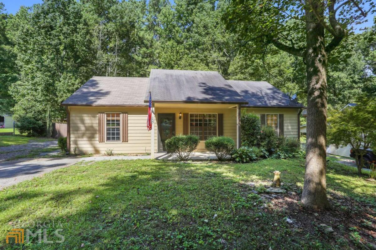 Don't miss out on this adorable cottage in the desirable city of White, GA! No HOA! This true ranch home has 3 bedrooms and 2 full baths with a split bedroom plan and fantastic closet space! Newly installed laminate flooring and fresh paint throughout. Enjoy the serenity of your private backyard with nearly new split rail fencing and a covered patio area for entertaining.