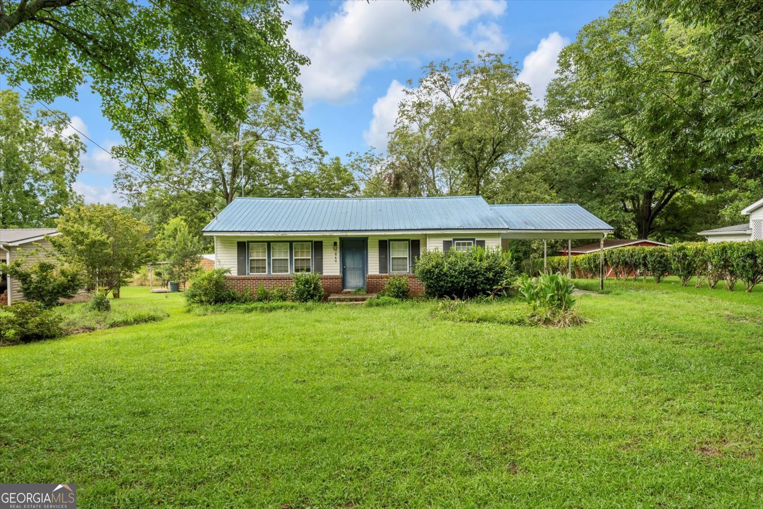 Investor Special - 3BR/2BA Ranch in the Heart of Washington, GA! Don't miss this opportunity to own a solid 3-bedroom, 2-bath ranch-style home in the charming and historic town of Washington, GA. Sitting on a spacious lot with a fenced-in dog run and a low-maintenance metal roof, this property is full of potential! With a little TLC and interior updating, this could be a fantastic flip, rental, or starter home. The layout is functional, and the bones are good - just needs some drywall repair and cosmetic updates to bring it back to life. Plenty of yard space for outdoor living, gardening, or future improvements. Located on a quiet street, yet close to local shops, restaurants, and the quaint town square.
