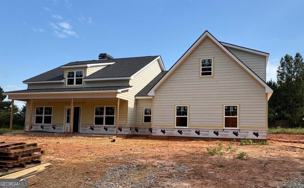 Discover the charm of the Beaufort plan in the highly sought-after Meadow Crest Subdivision. This brand-new 4-bedroom, 3.5-bath home spans 2,694 sq. ft. and is ideally situated in a quiet,upscale neighborhood just minutes from Lake Oconee, shopping, dining, and boat ramps. Step inside to an open floor plan featuring a large island kitchen with a walk-in pantry, stylish cabinetry, stainless steel appliances, and granite countertops. Enjoy meals in the breakfast area or in the separate dining room, which boasts a beautiful coffered ceiling. The vaulted great room is a cozy gathering space with a fireplace and built-in shelving. The main-level master suite offers a trey ceiling, a luxurious bathroom with a separate tub and shower, dual sinks, and an expansive walk-in closet. Also on the main floor are two additional bedrooms with walk-in closets and a shared Jack & Jill bathroom, along with a convenient laundry room and powder room. The fourth bedroom or study with a full bath is located above the two-car attached garage. Outdoor living is a delight with covered front and back porches perfect for relaxation. The home comes with blinds throughout, a sod lawn with a sprinkler system, and is located in a quiet neighborhood with streetlights, low HOA fees, and proximity to everything the lake area has to offer. The seller is offering to cover some closing costs when you choose preferred lender Kelly Dover of Cross Country Mortgage 678-283-1200.