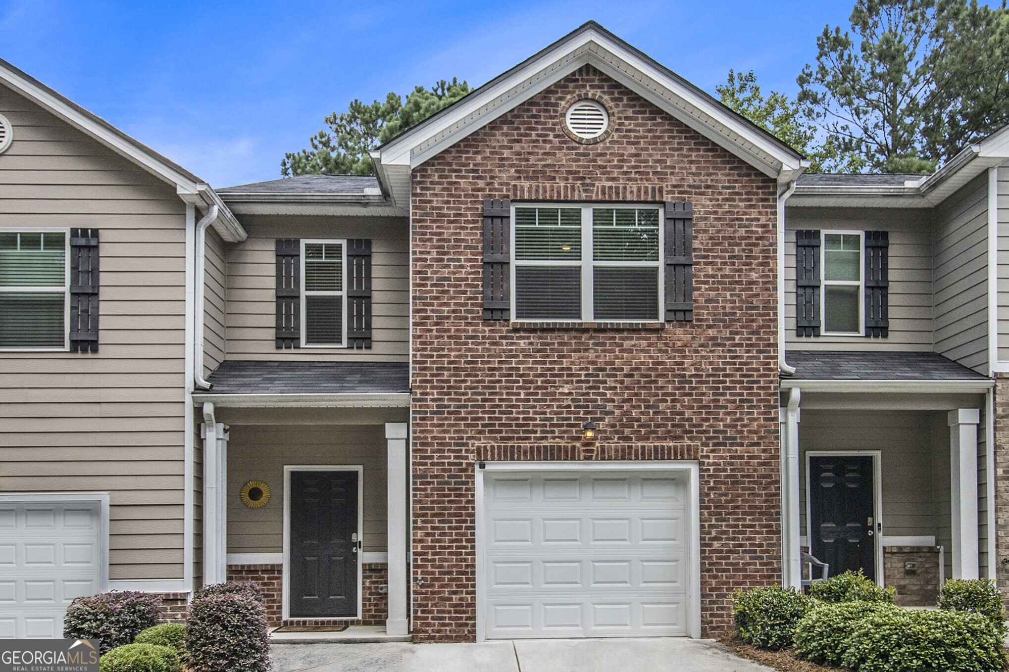 Turn-Key Townhome in a Tranquil Lakeside Community Ideal for Investors or Homeowners! Welcome to The Villas at Rogers Crossing a peaceful neighborhood offering easy access to major highways, shopping, dining, and entertainment. Whether you're commuting or exploring the local scene, this location offers the perfect balance of convenience and serenity. Step inside to discover a bright, Open-Concept Main Level with dark flooring and Fresh Paint throughout. The Kitchen is both stylish and functional, featuring Granite Countertops, Stainless Steel Appliances, and a center Island with a breakfast bar, perfect for casual meals and entertaining. An adjacent dining area flows effortlessly into the light-filled Family Room, creating a welcoming space for gathering. A convenient Half Bath completes the main level. Upstairs, the spacious Primary Suite offers a Walk-In Closet and a Private Ensuite Bathroom with Dual Sinks and an Oversized Tiled Shower. Two additional bedrooms share a well-appointed Hall Bath, providing flexibility for guests or family alike. Currently operating as a successful Airbnb, this property presents a fantastic opportunity for both short-term and long-term rental income. Whether you're an investor looking to expand your portfolio or a buyer seeking low-maintenance living, this Move-In Ready Townhome offers comfort, convenience, and charm all in one!