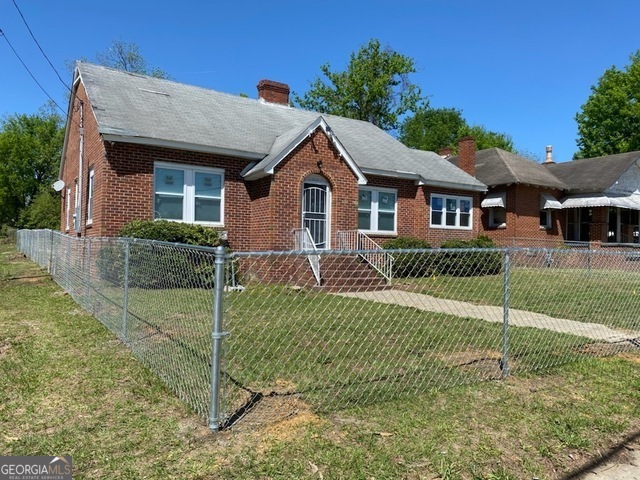 Located just minutes from downtown Macon, 697 Grenada Terrace offers a prime and convenient location. This property includes a brand new HVAC system, providing both central heat and air conditioning for year-round comfort. Inside, you'll find stylish wood laminate flooring throughout, adding a warm, contemporary touch to the space. The kitchen is equipped with stainless steel appliances, including a dishwasher and a two-door refrigerator, perfect for all your culinary needs. Additionally, the unit comes with a washer, dryer, and microwave for added convenience. Currently rented for $1,350 per month, this home provides excellent value in a prime location. Do not disturb tenants. Package deal includes for $275,000.