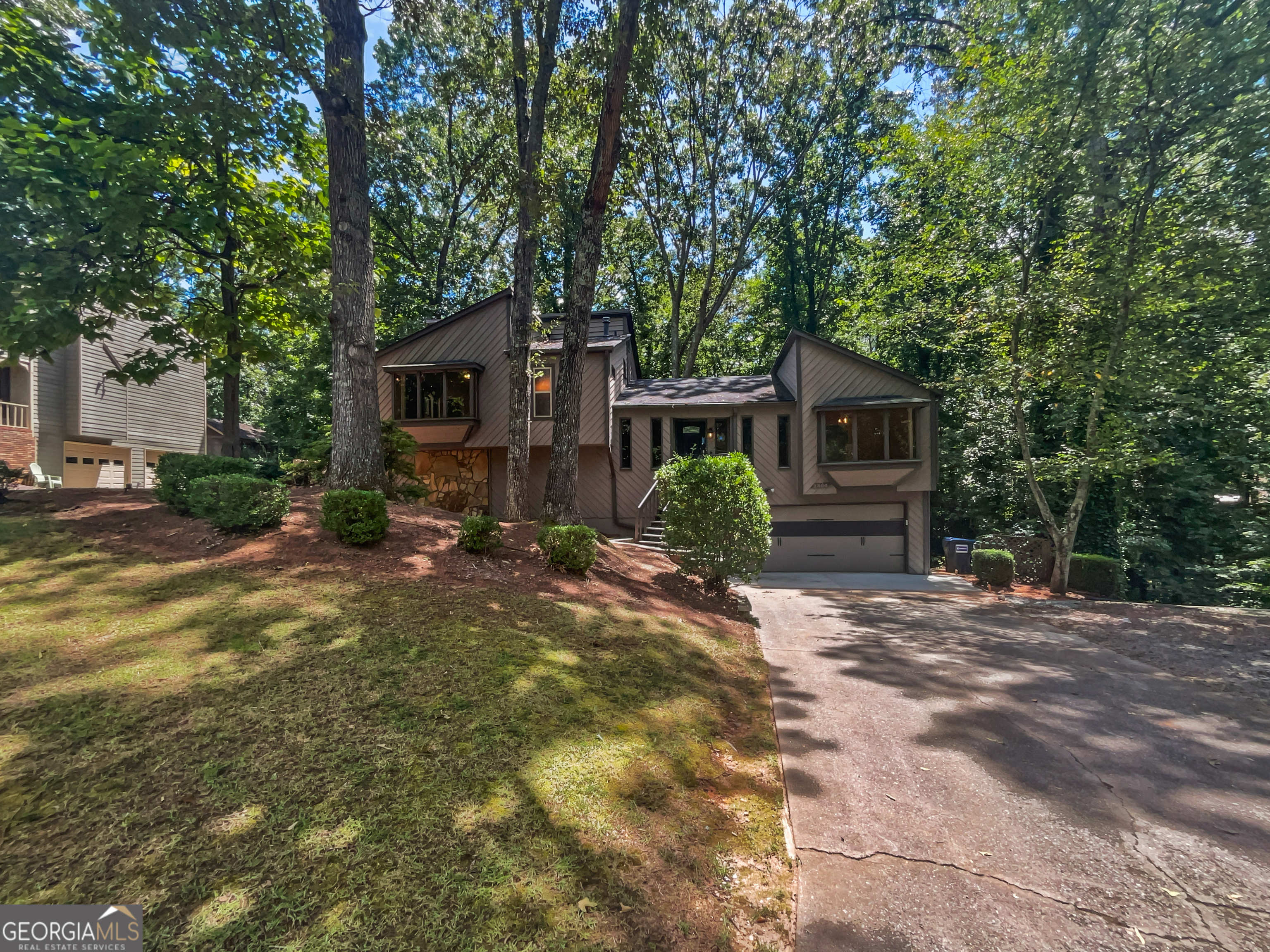 Included 100-Day Home Warranty with buyer activation. Welcome home! This beautiful 4-bedroom, 2.5-bathroom Marietta house is ready for your personal touches. Sleek hard flooring flows throughout the living areas. Head into the kitchen for your entertaining needs. The kitchen features gleaming stone counters, a stylish tile backsplash, stainless appliances, and ample cabinetry. The primary bedroom features multiple closets and an en suite. Whether you want to relax or entertain outside, the backyard presents ample opportunities with a beautiful deck, including two covered areas (one screened-in). Make this new home yours!