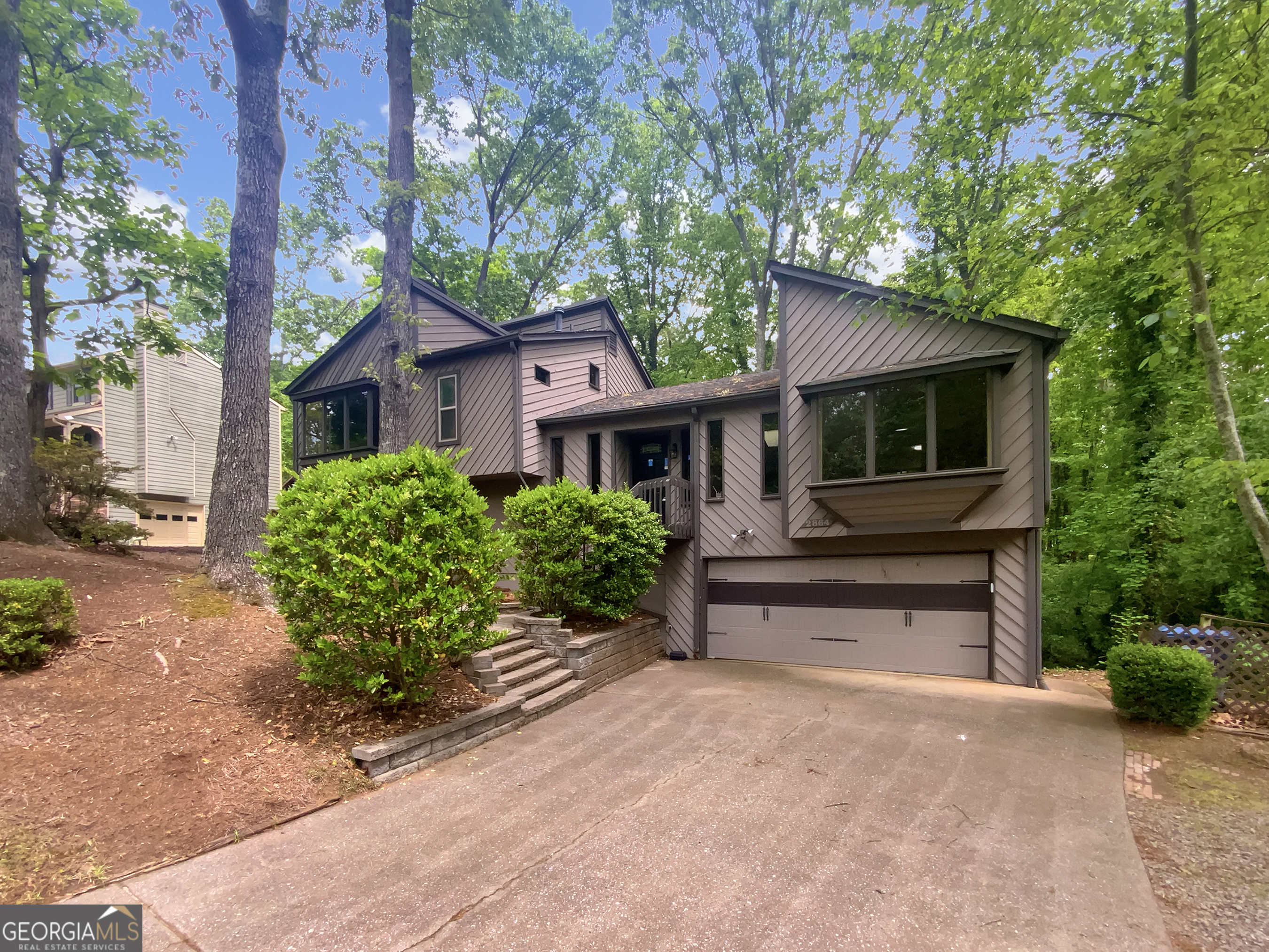 Welcome to this beautiful 4-bedroom, 2.5-bath Marietta home that's ready for your personal touches! Warm hard flooring flows throughout the living room, where you'll find a fireplace and a soft neutral color palette. Step into the kitchen to see stone counters, stainless appliances, and a stylish backsplash. The primary bedroom comes complete with an en suite bath and plenty of storage. Relax in the fenced-in back yard, where you'll find an inviting deck. Make this stunning home yours today!100-Day Armadillo Home Warranty available at closing