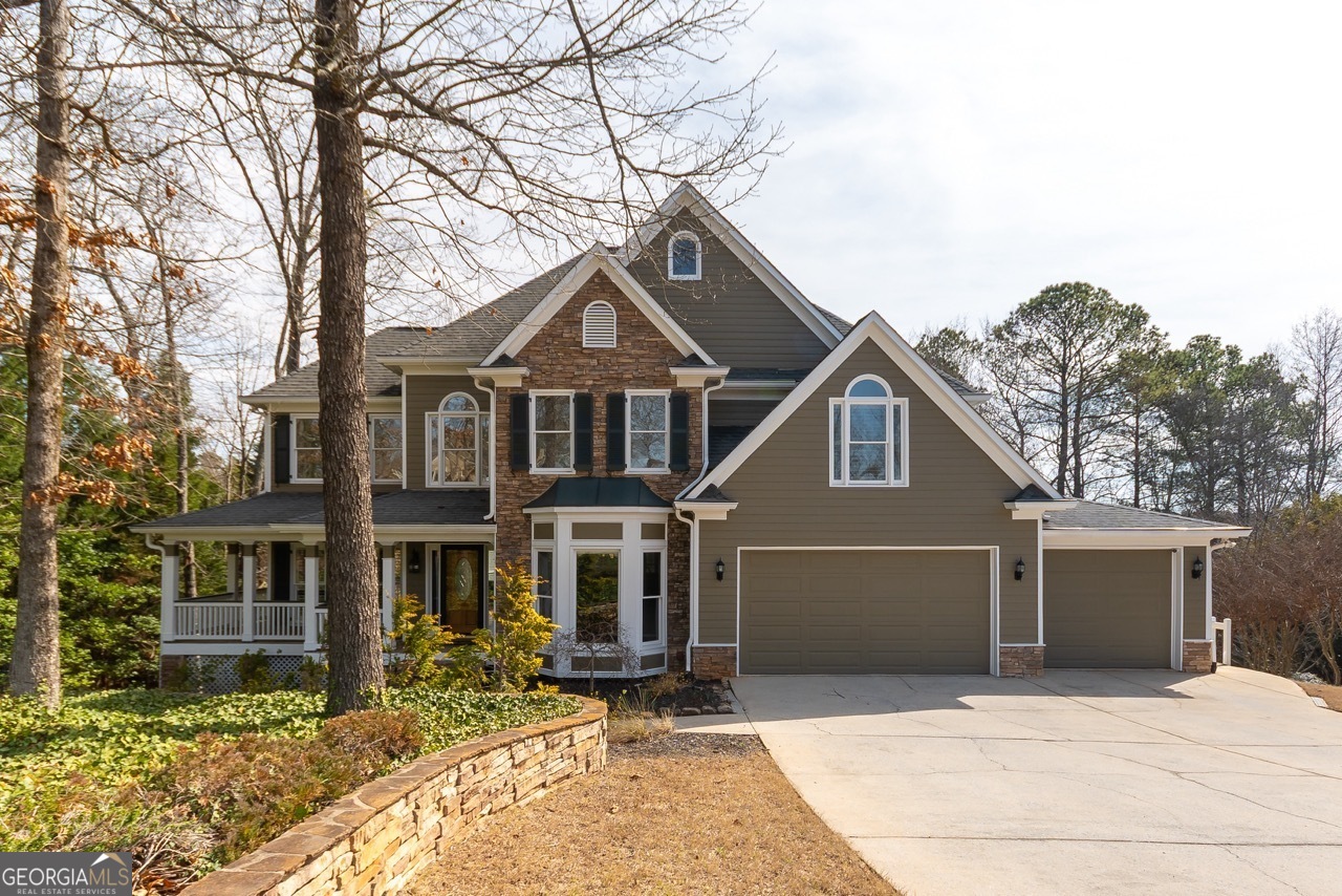 Located in the heart of Marietta, this exceptional home offers the opportunity to live in one of the area's most sought after neighborhoods, amenity-rich Hardage Farm. Enjoy stunning views of Kennesaw Mountain National Park from multiple outdoor living spaces, including two beautifully designed decks, screened porch, and covered patio. This custom-built home provides thoughtful design to please every member of the family. Four bedrooms, three 1/2 baths, separate dining room and flexible den/playroom/library, and a fabulous two-story fireside great room featuring a wall of windows for tons of natural light. The chef-inspired, fully updated kitchen includes stone counters, breakfast bar/prep area, Wolf range, pantry, and additional dining space. Upstairs the luxurious primary suite is a true oasis with tray ceiling, sitting room, oversized tiled shower and separate soaking tub. Three additional bedrooms include one with a connecting covered deck, perfect as a home office with a view! The fully finished terrace level provides plenty of additional living and recreation space, a kitchenette, bar, and full bath. Neighborhood amenities include clubhouse, pool, tennis, playground, and a fishing pond. Outstanding West Side Elementary, Marietta Middle and Marietta High School, and conveniently located minutes from Marietta Square, Kennesaw Mountain, Marietta Country Club, The Avenues, and more!