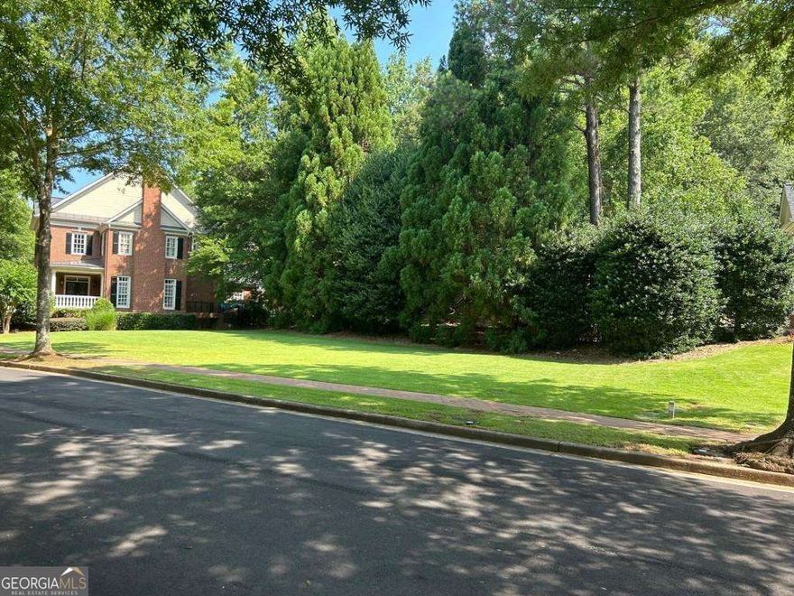 Discover one of Ellard's last private lots! Ellard, nestled along the serene banks of the Chattahoochee River, is a prestigious community that offers an unparalleled live-work-play lifestyle. With 24-hour gated security, over 90 acres of green space, scenic walking trails, swim/tennis facilities, and a state-of-the-art fitness center, you'll have everything you need at your fingertips. This rare, flat lot provides the perfect opportunity to create the home of your dreams. Equipped with an irrigation system and water meter, it offers endless possibilities for your custom build. Enjoy the convenience of nearby Ellard Village and Mercantile Exchange for all your shopping and dining needs. Don't miss your chance to build in this amazing community.
