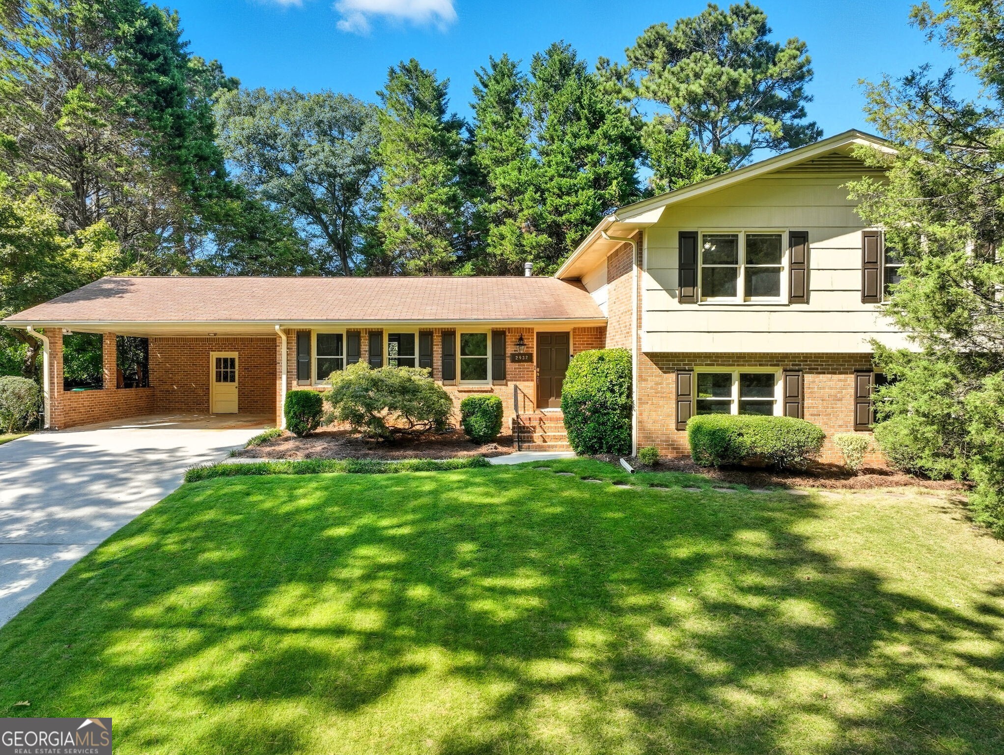 Rare opportunity for a sprawling mid-century home with a private backyard oasis in the beautiful and active Country Squire neighborhood. There's room for everyone - with three distinct living spaces including a formal living room, a family room with built-in brick fireplace, and a huge bonus room with closet. Plus, four large bedrooms, a classic dining room, and a renovated eat-in kitchen with marble counters. Gorgeous hardwoods on the main and all of the upstairs where you'll find the large owner's suite with private full bath and true walk-in closet. Then step outside to the serene, grassy backyard with two shaded patios, private fencing, and storage shed. Other conveniences include tons of natural light, true laundry room, guest half bath, and large 2 car carport with separate storage room. All in a quiet walkable neighborhood with swim/tennis, pocket parks and trails, near restaurants and shopping - and a short drive from your intown favorites!