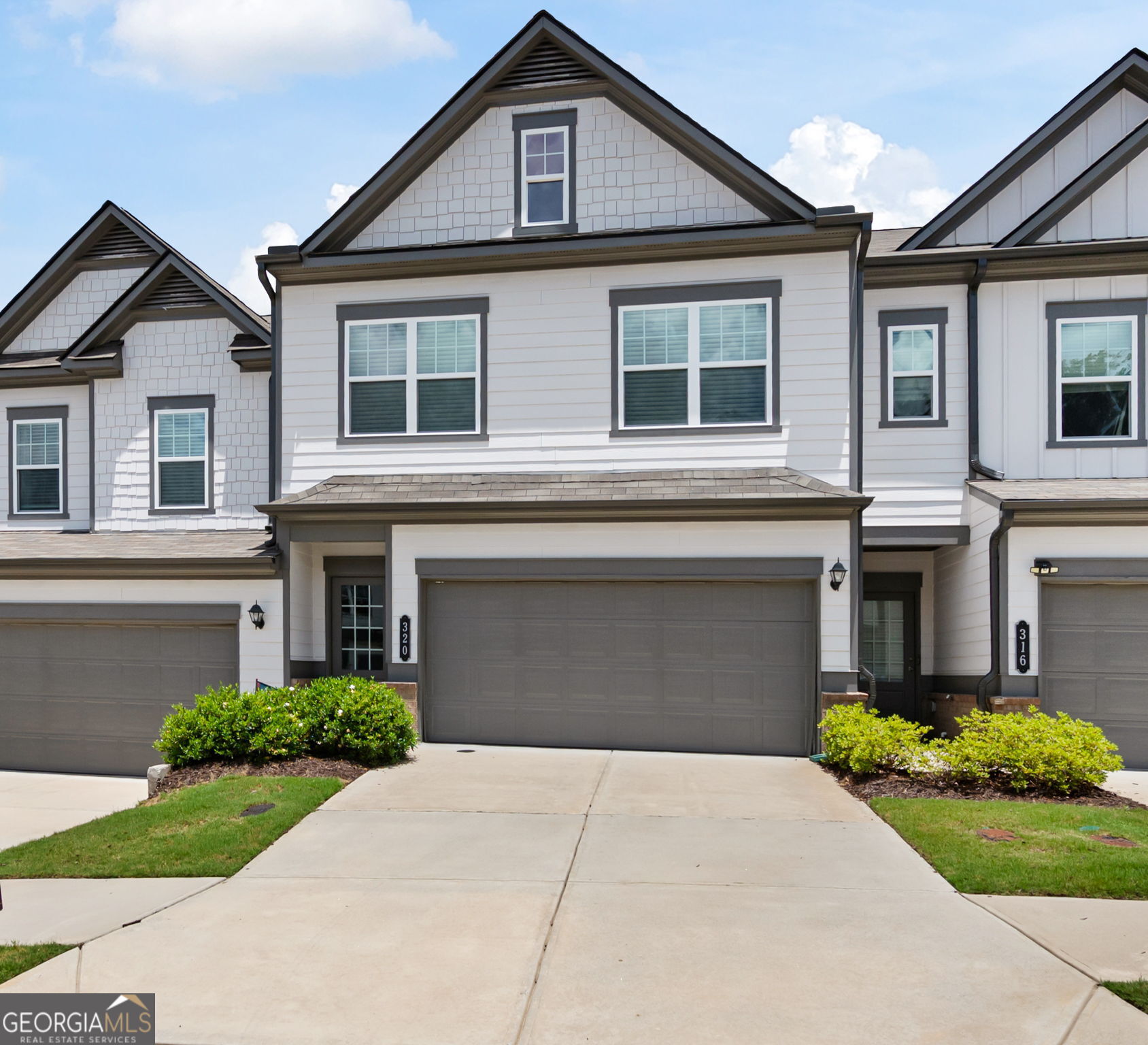 Welcome to this beautifully maintained 2022-built Ellison townhome, offering modern comfort and a prime location between the vibrant downtowns of Roswell and Woodstock. With stylish design and a thoughtful layout, this home is move-in ready and perfect for those seeking low-maintenance living without compromising on space or style. Step inside to a gracious foyer that opens into an expansive main living area, seamlessly connecting the kitchen, dining, and family room-ideal for entertaining or cozy evenings at home. The kitchen features sleek cabinetry, a center island, and rear yard access for easy outdoor dining and grilling. Upstairs, the spacious owner's suite offers a luxurious retreat with a large en-suite bath and an oversized walk-in closet. Two additional bedrooms, a full bath, and a convenient second-floor laundry room complete the layout. Located in the desirable Concord community, this home provides easy access to parks, shops, dining, and top-rated schools-all in a thriving corridor of North Metro Atlanta. Don't miss this opportunity to enjoy like-new construction without the wait!