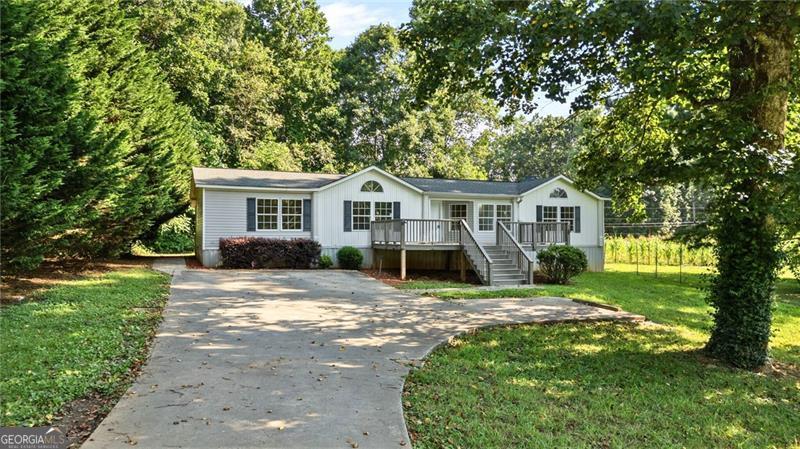Why rent when you can own North-Georgia freedom for just $265K? Welcome to 3972 Westmoreland Road, Cleveland GA-a recently renovated home on a level 1-acre lot with zero HOA rules. New LVP flooring, fresh paint, new shaker kitchen cabinets, new appliances, and stylish baths mean you can move right in and start living. Two flex rooms can be adapted to an office, gym, or guest space; a large deck overlooks a tree-lined yard, ready for fire pits, gardens, chickens, or your RV/boat. Live the lifestyle locals love-minutes to Helen's alpine village, award-winning wineries, Chattahoochee National Forest trails, trout streams and the many lakes and rivers. Quick access to Hwy 129 & 75 puts Gainesville, Dahlonega and Atlanta within easy reach, yet star-filled night skies still greet you at home. All-electric systems, public water + private septic keep monthly costs low; payment could be less than area rent. Whether you're a first-time buyer, down-sizer or STR/long-term investor, this turn-key property delivers hard-to-find affordability without sacrificing style or mountain-town fun. Schedule your tour today-homes at this price, in this condition, on land, vanish fast! The title is retired. 3D Tour, floorplan & video available.