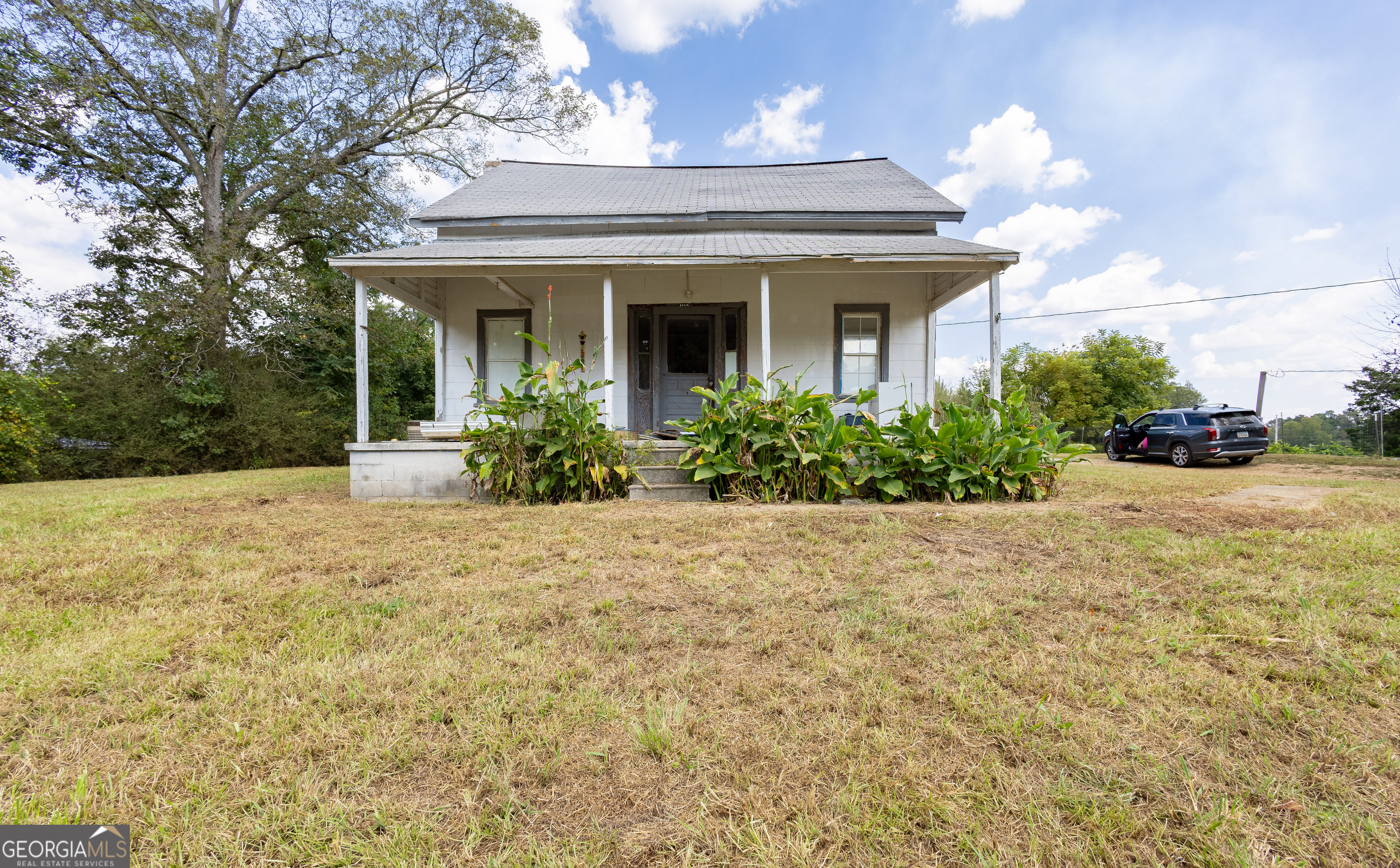 Charming 1935 Fixer-Upper on Over Half an Acre! Nestled on a 0.57-acre lot in Heflin, this 1,260 sqft single-family home offers timeless character and renovation potential. Featuring 2 bedrooms, 1 full bath, and a spacious layout, the property includes original wood paneling, vintage kitchen cabinetry, and a wide front porch perfect for relaxing afternoons. The carport adds convenience, while the concrete foundation, wood siding, and asphalt roof provide a solid base for restoration. Surrounded by mature trees with plenty of open yard space, this home is ideal for investors or DIY enthusiasts seeking a project with promise. A rare opportunity to restore a classic Southern home with plenty of charm! This is CASH only deal.