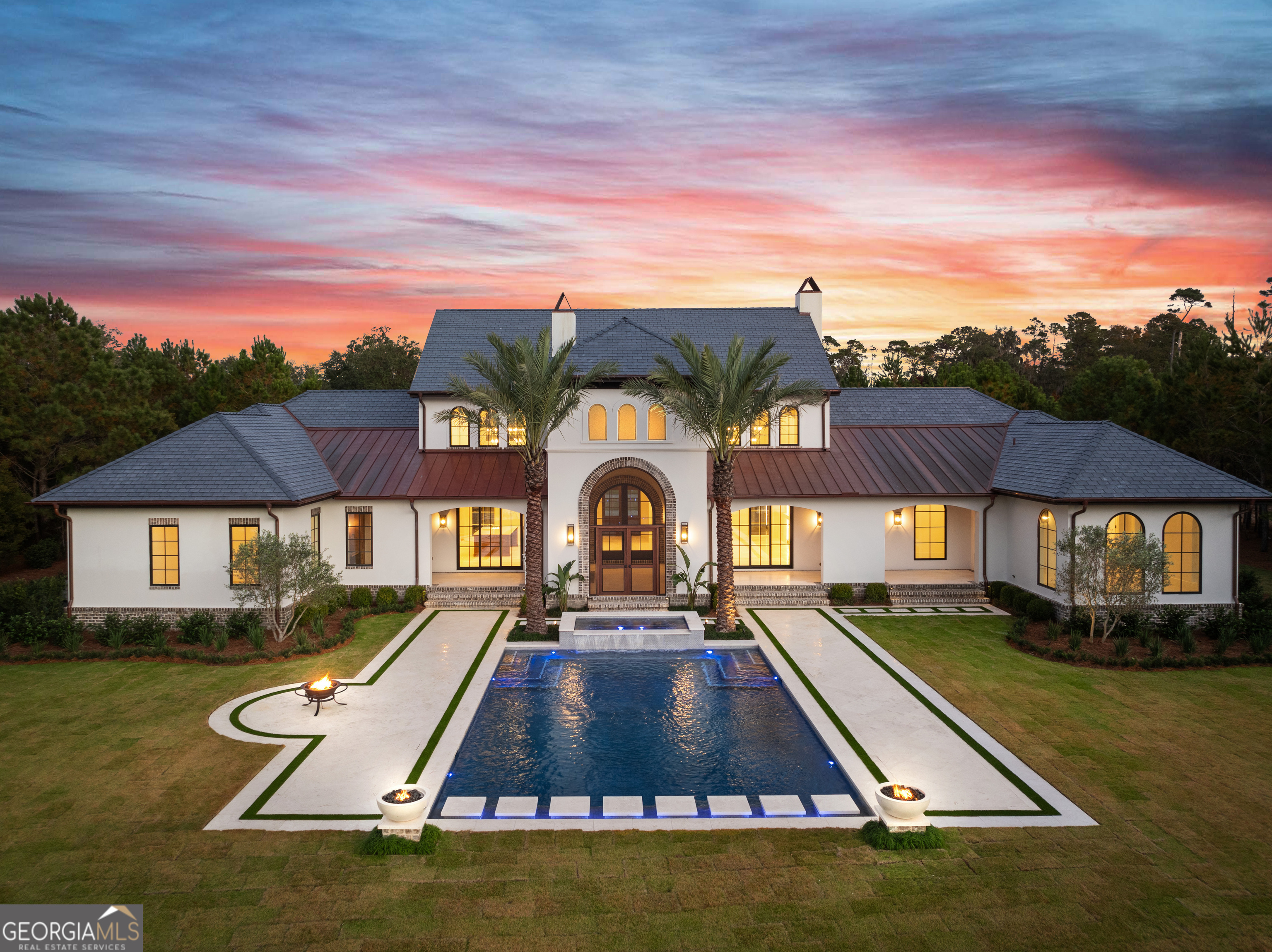 Just completed, move-in ready! Nestled on one of the less frequented roads in Frederica Township and overlooking the lake, this all-on-one-level new construction home combines luxury living and the beauty of nature. Overflowing with thoughtful details, this impressive home features arched windows and walkways, Italian stone floors, breathtaking vaulted ceilings with pecky cypress wood detailing, and natural light filling every corner of this airy 4-bedroom, 4.5 bathroom European-style beauty. Step inside to discover a spacious open floor plan where the heart of the home awaits. The gourmet kitchen is a chef's dream, complete with state-of-the-art appliances, sleek countertops, and a scullery for additional prep and storage space. Entertain effortlessly in the adjacent dining area or gather around the cozy fireplace in the grand living room. Tucked away from the main living areas, the den is the perfect spot for a quiet conversation or watching your favorite movie. The master suite is a true private retreat with stunning lake views, a luxurious ensuite bathroom featuring a soaking tub and dual vanities, and an impressive walk-in closet. Each additional bedroom is thoughtfully designed with ample space and privacy. The large study is thoughtfully located at the front of the home, just as you enter the home from the breezeway connecting the 3-car garage. Outside, the front porch welcomes you with its charming appeal, while the expansive back porch offers a perfect spot to unwind and savor the picturesque views of the tranquil lake. Imagine hosting gatherings or simply relaxing in this idyllic outdoor space complete with an outdoor kitchen overlooking your picturesque private, spa-like pool and meticulously landscaped yard complete with a fire pit and private dock. A celebrated private club, Frederica Golf Club offers an impressive list of amenities including fine dining, tennis, pickleball, fitness center, boating, fishing, and swimming. A Tom Fazio designed golf course, complete with over 40 acres of practice facilities and a state-of-the-art golf learning center, provides for an extraordinary golfing experience each time out on the course. Access to amenities is subject to Frederica Golf Club membership. Please inquire about the special membership opportunity available with the purchase of this home. Don't miss your chance to own this exceptional new construction home with unparalleled views. Move-in ready! Link for rendered drone fly-over: https://youtu.be/Jzu9tBYWL8U