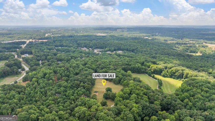 Superb acreage with potential just waiting to be tapped!  Land already features a huge 40' x 60' metal building big enough to store an RV, cars, and more... plus beautiful land with rolling hills, trees, and elbow room galore!  Tried of HOA life?  This could be just the land you're looking for to get real space of your own.      Land includes an easement to enter off a private gravel road but the property also abuts to the paved country road called Lester Wood Road and has room for a new entrance directly off of paved Lester Wood Road.      Map of the lot provided in the property images.      Tax records may not yet accurately reflect the acreage that will be included with the sale of the property.