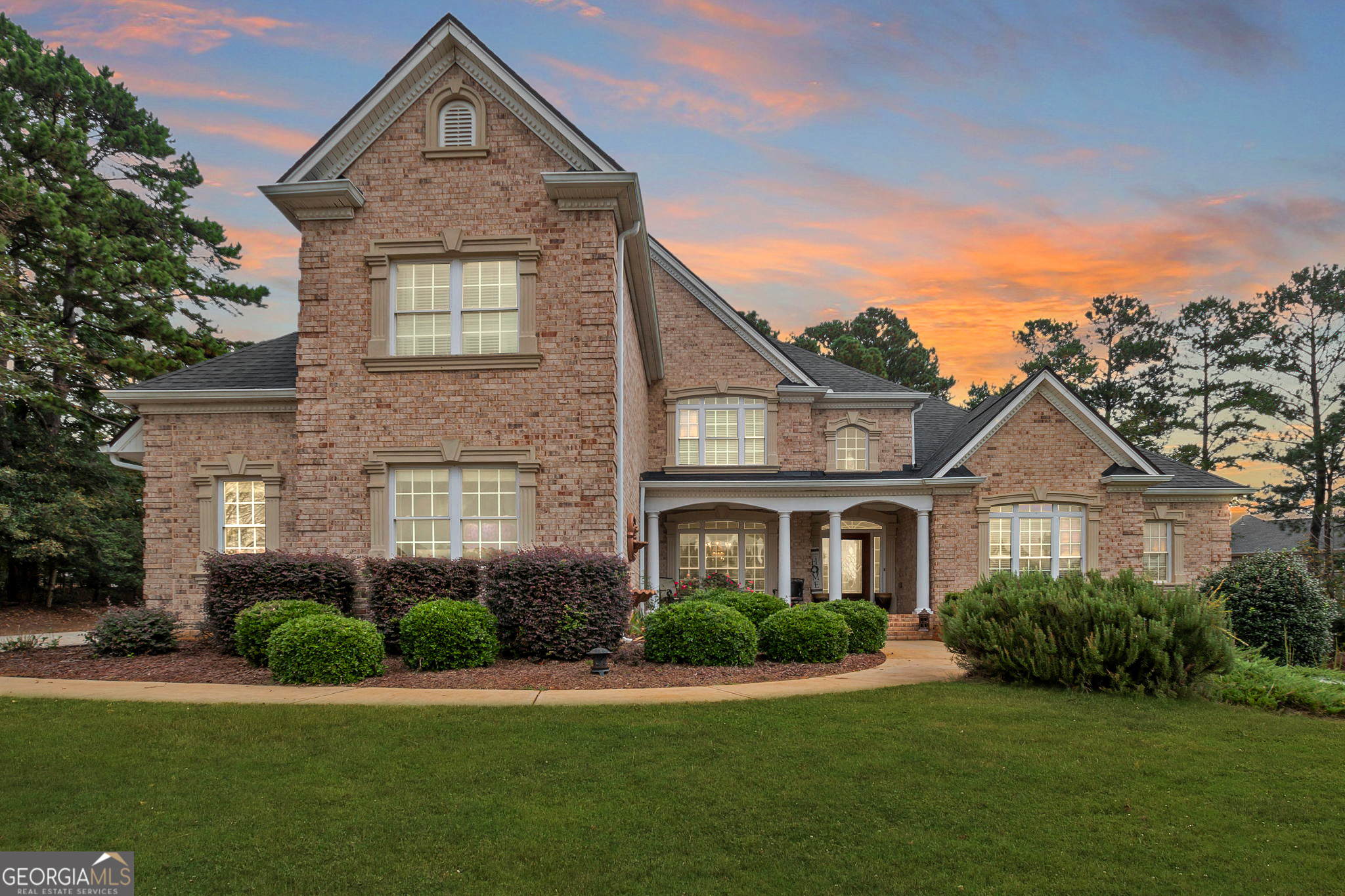 First showings 10/12! Welcome to a quiet 7 bedroom 5 bath home that truly has it all-a stately 4-sided brick executive residence nestled on 1.2 private acres. From the moment you arrive, you'll feel the elegance and space this property offers. The luxurious master suite on the main level with separate sitting room is a true retreat, complete with its own fireplace and spa-like bathroom. A second main-level guest suite makes hosting friends and family seamless. Inside, you'll find expansive living spaces-formal living and dining rooms, a cozy keeping room, and an open kitchen with walk-in pantry, breakfast bar, and breakfast area designed for holiday gatherings. Hardwood floors, fresh paint, and detailed ceilings add warmth and charm throughout. Step outside to a screened-in porch and spacious deck, perfect for enjoying Georgia's four seasons. The full finished basement offers endless possibilities with and available second full kitchen, home theater, or space can be utilized as a gym, playroom or an additional in-law living suite. With a 3-car side-entry garage and three fireplaces, comfort and convenience meet timeless design. Beyond your doorstep, you're minutes from parks, walking trails, fishing, shopping, and dining, with easy access to downtown Atlanta and Hartsfield-Jackson Airport, ideal for commuters or frequent travelers. This move-in ready estate isn't just a house, it's the lifestyle upgrade you've been waiting for! Home is also available for lease #10621811