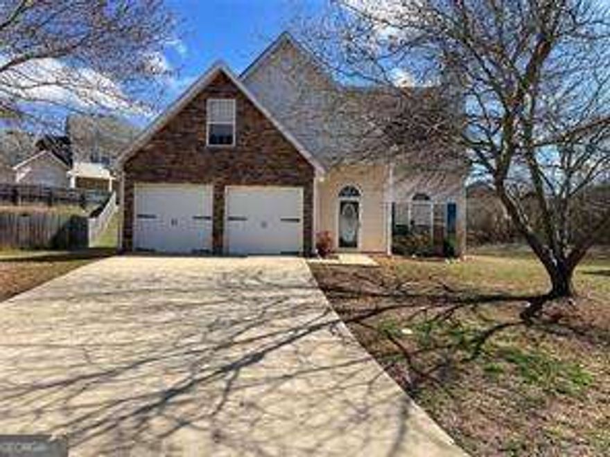 Looking for a Henry County lease at a great price with the primary bedroom on the main? With new carpet and paint throughout? Check out this beautiful 4 bedroom single family home in Locust Grove, it's the one you've been looking for! Situated on a cul-de-sac, the home offers plenty of outdoor living space out back for entertaining on your deck right outside the dining area. Inside, you'll find a spacious living room with a gas fireplace, open kitchen with a breakfast bar, and a main level primary bedroom with en suite bathroom and laundry off the garage. The home also features three additional bedrooms and a full bathroom upstairs. With its convenient location near shopping at Tangier Outlets, restaurants, and quick access to I-75, this is the perfect place to call home in the Locust Grove school district. And don't forget access to the community pool and tennis court