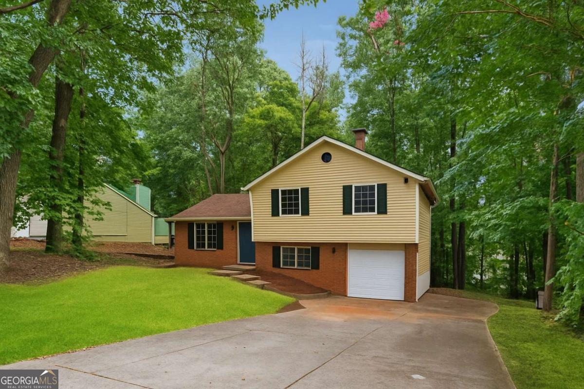 Discover your ideal home at 1984 Singer Way, Lithonia, GA 30058, a charming residence nestled in a sought-after neighborhood. This inviting home boasts a fresh and modern interior with newly painted walls, creating a bright and welcoming atmosphere. Situated on a spacious corner lot, the property offers excellent curb appeal and ample outdoor space. Step outside to the relaxing rear deck, perfect for hosting gatherings or enjoying quiet evenings. The home features a convenient garage, complete with a brand-new door and opener for secure and easy access. Inside, a versatile space awaits, ideal for use as a cozy sitting area or a productive home office, highlighted by a warm brick fireplace that adds character and charm. Stay comfortable year-round with a new exterior HVAC unit. Don't miss the chance to own this beautifully updated home, blending style, comfort, and functionality in a prime Lithonia location. Schedule a showing today to experience all that 1984 Singer Way has to offer!