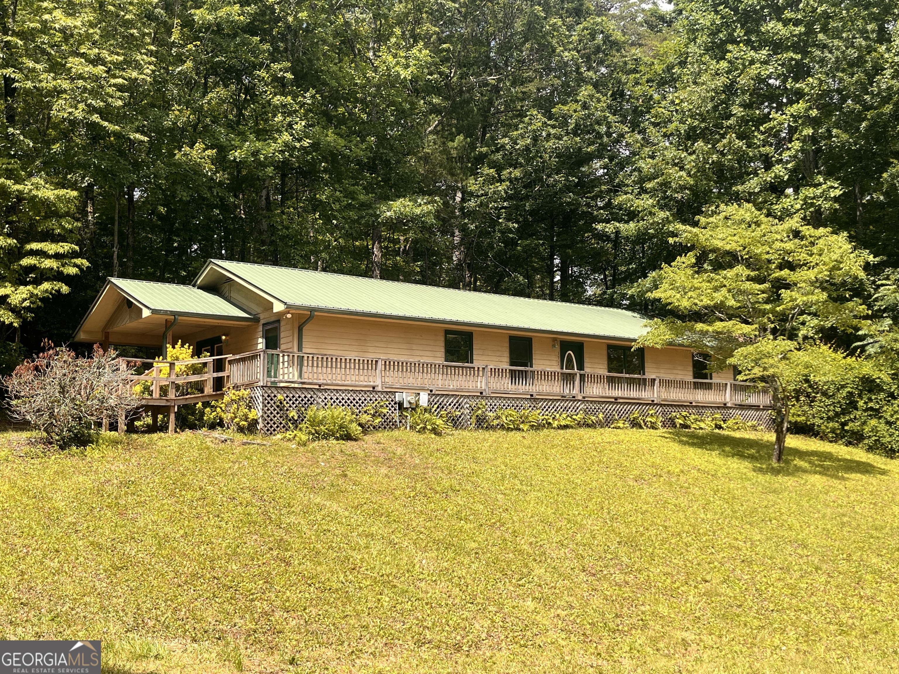 All one level living 3 bedroom, 2 full bath home on 1+- with outbuilding turned small guest house. This home is the perfect opportunity to make it your own by updating it with your favorite paint colors, flooring and upgrades! This home could also be a rental property investment opportunity! Wood burning stove, tile garden tub + shower in master bath and large front deck for entertaining. The slightly sloping front yard provides ample room for children and animals to play or to grow your own garden! Only minutes from downtown Clayton, area schools and recreation!