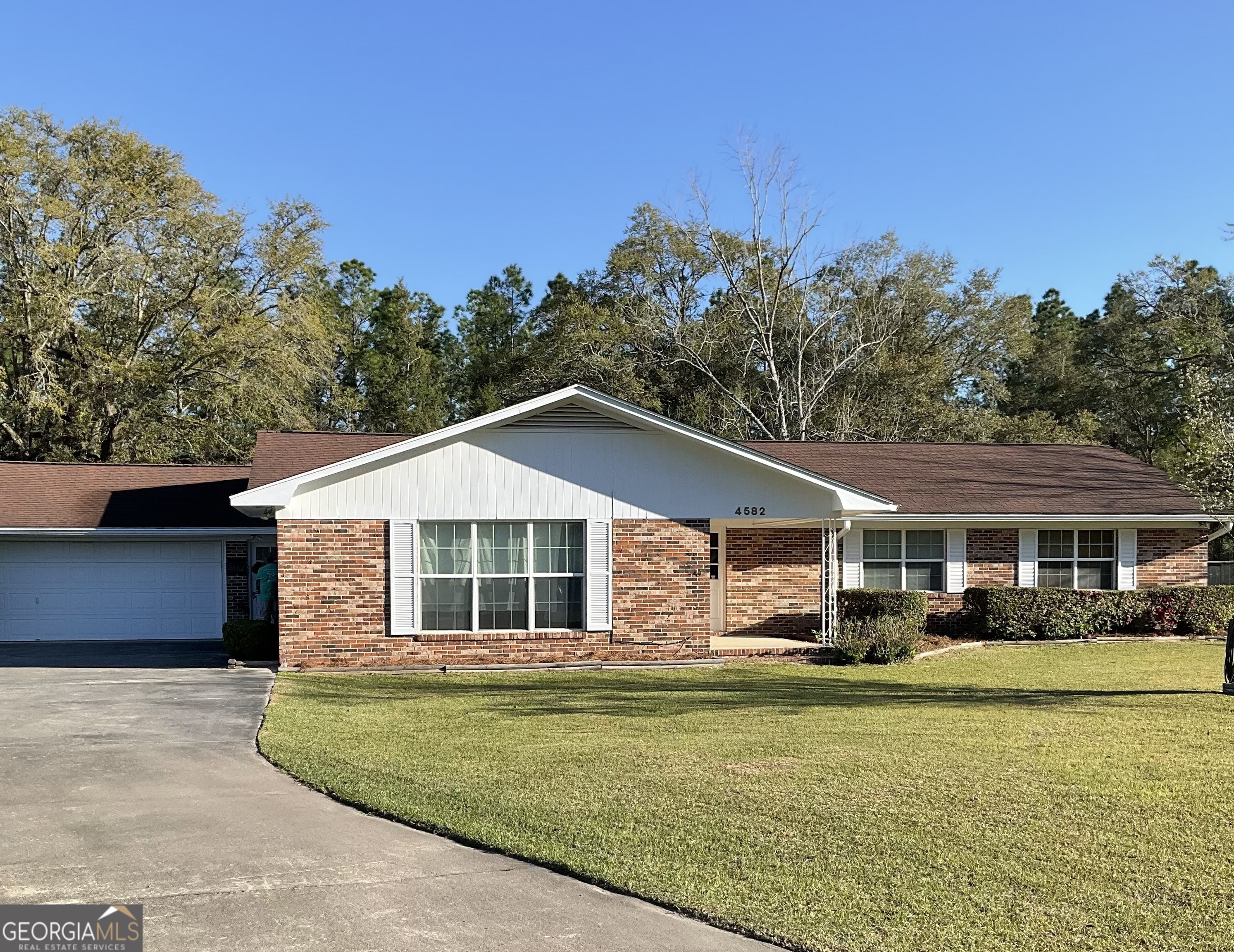 Wow this one is for you! Fantastic property with an outstanding location. Country living at its finest. Home is close to the elementary school, but just slightly outside of Blackshear shopping and entertainment. This home has so many great features. Kitchen is a chief's delight with custom built cabinets featuring slide out shelves for easy access, new appliances all in stainless steel and beautiful overhead lighting. An amazing custom-built pantry that can be used for kitchen or den use. What a wonderful den with a full mantel and propane-controlled fireplace insert, take the double doors out to the enclosed sunroom. The large eating area just off the Kitchen. Originally a formal living room can be transformed into a game room or office. The inside laundry area is easy access to kitchen and den. Master bath updated with walk-in shower just off the master bedroom that is large enough for a king bed and small seating area, three separate lighted closets make storage to problem at all. Three additional bedrooms all with easy access to the second full bathroom that features a jet soaking tub and a walk-in shower. For the comfort and never having to take a cold shower even with a full house there are two water heaters to provide ample hot water for either a relaxing soak in the tub, or a long relaxing shower. All bedrooms have nice large lighted closets, some shelving as well. This home has been well kept and loved by its prior owners with all paperwork for appliances, ac and roof work. Outside there is a great shop for the owner looking for a place to protect their treasures or to work on the hobby vehicles. Maybe a side occupation just for the fun? This is definitely a must see, one not to miss. This home is a treasure just waiting for you with a total square footage of 2380.