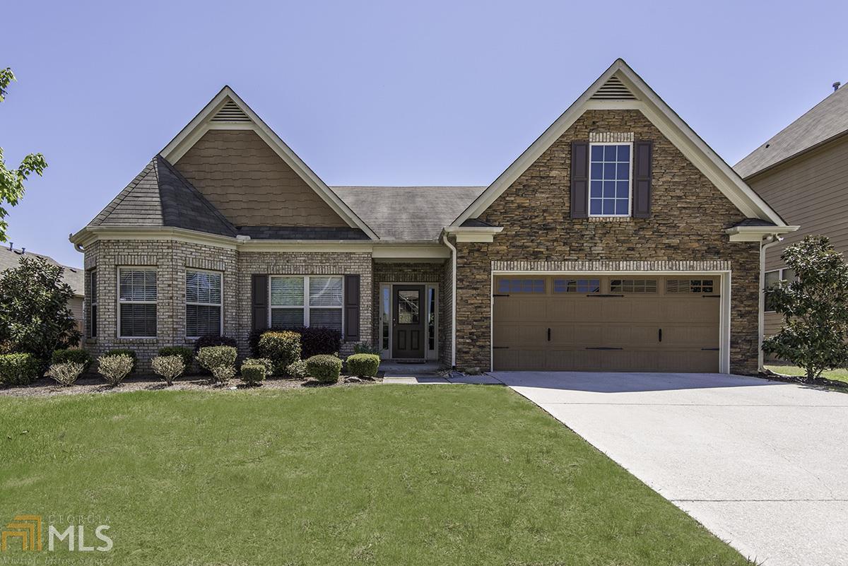 Immaculate master on the main for easy living in beautifully maintained Wynterberry Parke. This bright ranch features hardwood flooring and a vaulted ceiling that leads into the spacious family room with corner fireplace. Enjoy double vanities, separate tub & shower and large walk-in closet in the owner's suite. Elegantly appointed kitchen w/ formal dining room features separate breakfast area opening to the outdoor covered patio. Private, fenced, flat backyard is perfect for festive entertaining or hosting playgroups. Great school cluster in north Gwinnett!