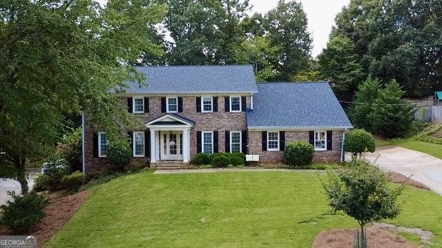 Welcome home to 5232 Wynterhall Drive! This beautifully renovated 4-bedroom, 3.5-bathroom residence perfectly blends modern elegance with everyday comfort in one of Dunwoody's most desirable neighborhoods. The heart of the home features a stunning renovated kitchen open to the family room with an upgraded stone fireplace, ideal for gatherings. The remodeled primary suite is a true retreat with a raised trey ceiling, an added window for abundant natural light, an expanded spa-like bathroom, and a spacious walk-in closet. Step outside to your private oasis designed for entertaining and relaxation. A covered porch and two decks overlook the walk-out backyard, enhanced by lush zoysia sod, a stone retaining wall, and beautiful Japanese maple trees. French drains ensure easy maintenance, while the setting invites memorable evenings outdoors. This home has been freshly painted and thoughtfully maintained with big-ticket upgrades including a new roof (2025), hot water heater (2024), garage door (2023), and more - giving buyers peace of mind. Unbeatable Location & Lifestyle: Situated just minutes from Dunwoody Village, Spruill Center for the Arts, and Dunwoody Nature Center, residents enjoy a vibrant community rich in culture, recreation, and dining. Grocery shopping, coffee shops, and popular local restaurants are less than a mile away. Families will love the top-notch schools, including award-winning Austin Elementary, as well as access to nearby swim/tennis clubs. For commuters, the property is ideally located near three access points to GA-400, keeping you connected without the stress of traffic. Don't miss the opportunity to make this stunning Dunwoody home yours. Schedule your private showing today and experience the perfect balance of luxury, convenience, and community living. (Owner is a licensed GA real estate agent.)