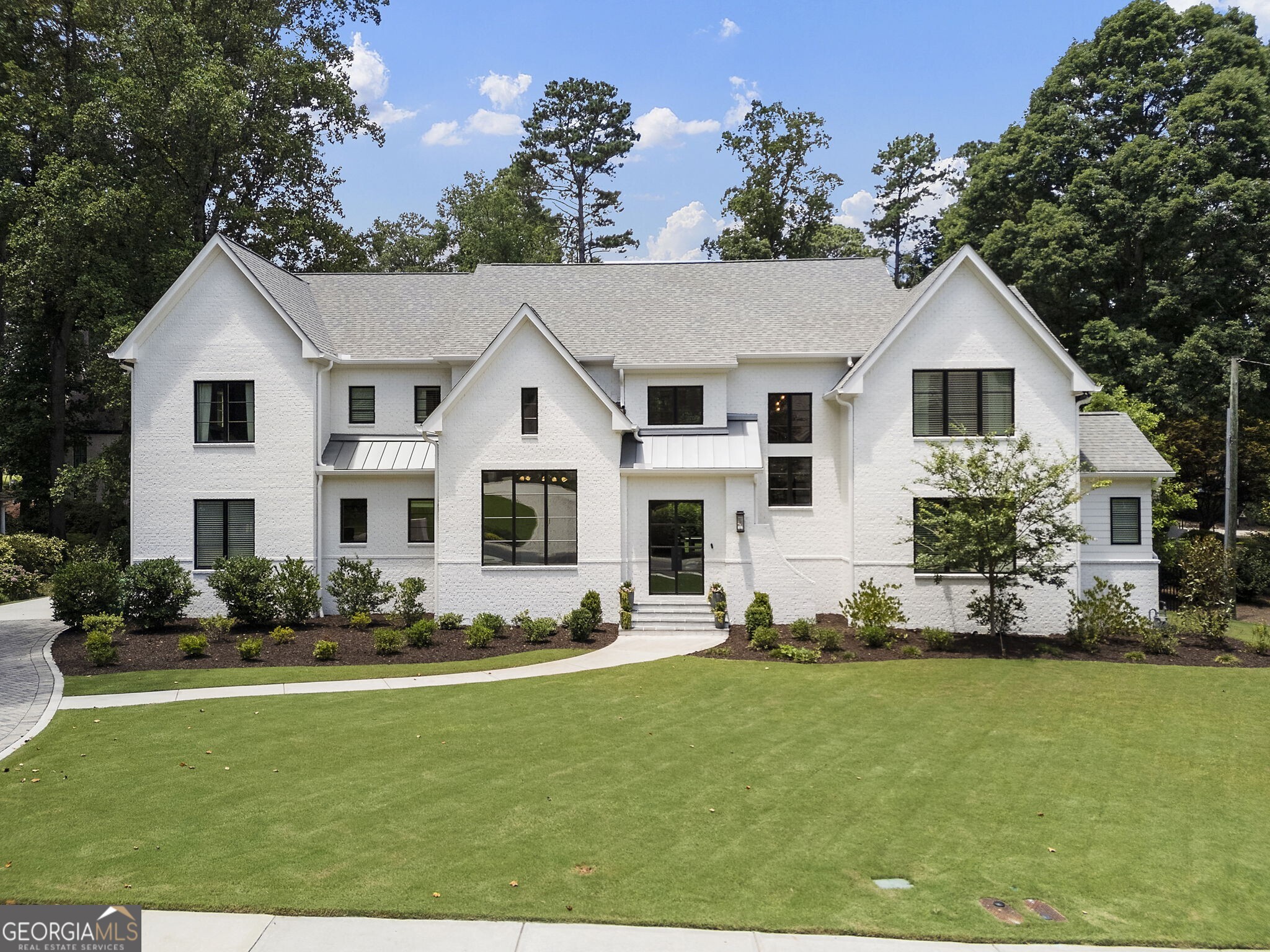 Gorgeous newer construction home by Harrison Homes perfectly tucked away in one of Atlanta's most coveted neighborhoods! High end, designer finishes throughout and steps from 27 acre Silver Lake, welcome to Brookhaven's prestigious Brittany neighborhood. This beautifully curated home features 10-foot ceilings, pristine hardwood floors, and ample living space inside and out with professionally landscaped, flat walk out backyard perfect for throwing the ball and room for a pool. Its dreamy eat-in kitchen will blow you away with top-of-the-line appliances, honed quartz countertops, dual dishwashers, two beverage centers, a hidden daylight pantry, and a full scullery-perfect for entertaining with ease and style, opening up to two fireside living spaces and an outdoor blue stone patio with fireplace. Mud room off of insulated 3-car garage with lockers, laundry and powder room make daily life organized and easy. Main floor includes private guest suite, office, dining room with soaring Pella windows and charming butlers pantry with exposed brick and wine rack. Primary suite upstairs with spa - like bath with shower and soaking tub, huge custom closets, and vaulted shiplap ceiling. Second laundry room is upstairs with plenty of custom cabinetry for storage. Beautiful millwork throughout and tons of natural light, you will feel the warmth, beauty, and functionality of this home the minute you step through the front door! Membership to the Brittany Club is optional and features 6 tennis courts, pickleball, clubhouse, swim facilities, lake activites, scenic trails, playground, and an active social calendar. Award-winning schools, minutes to renowned restaurants, shopping, and medical facilities. You've discovered the best kept secret in the city - live your best life here in this truly idyllic setting!