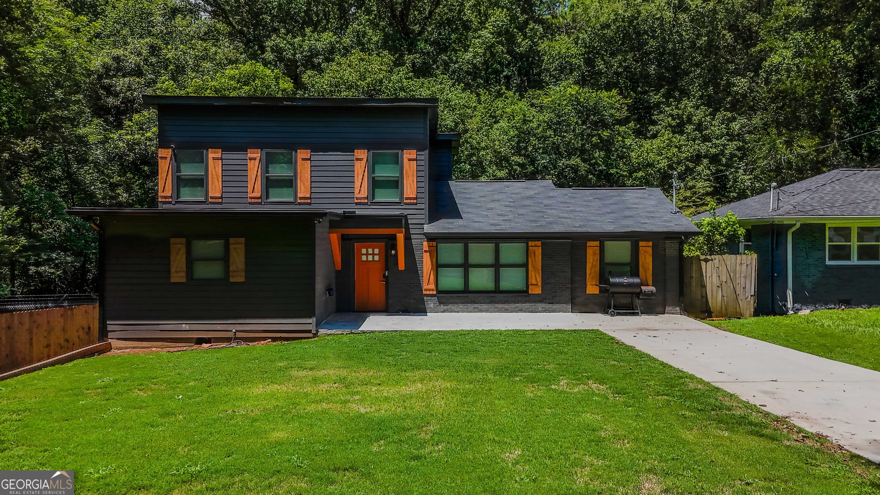 Discover this modern 4-bedroom, 3-bathroom home located in the Historic Lakewood Subdivision. Designed with comfort and convenience in mind, this property is ideal for both long-term living and short-term stays. Step into a stylish kitchen featuring stainless steel appliances-range, dishwasher, over-the-stove microwave, and refrigerator-paired with timeless shaker-style cabinetry. The home is equipped with a full alarm system, integrated smoke alarms, and secure electronic keypad locks for peace of mind. Enjoy unbeatable location benefits: just minutes from shopping, grocery stores, and a wide variety of restaurants. The property is less than one mile from a golf course and only 10 minutes from both Downtown and Midtown Atlanta, offering quick access to work, hospitals, and entertainment. This home is available furnished or unfurnished, making it a flexible option to suit your lifestyle needs.
