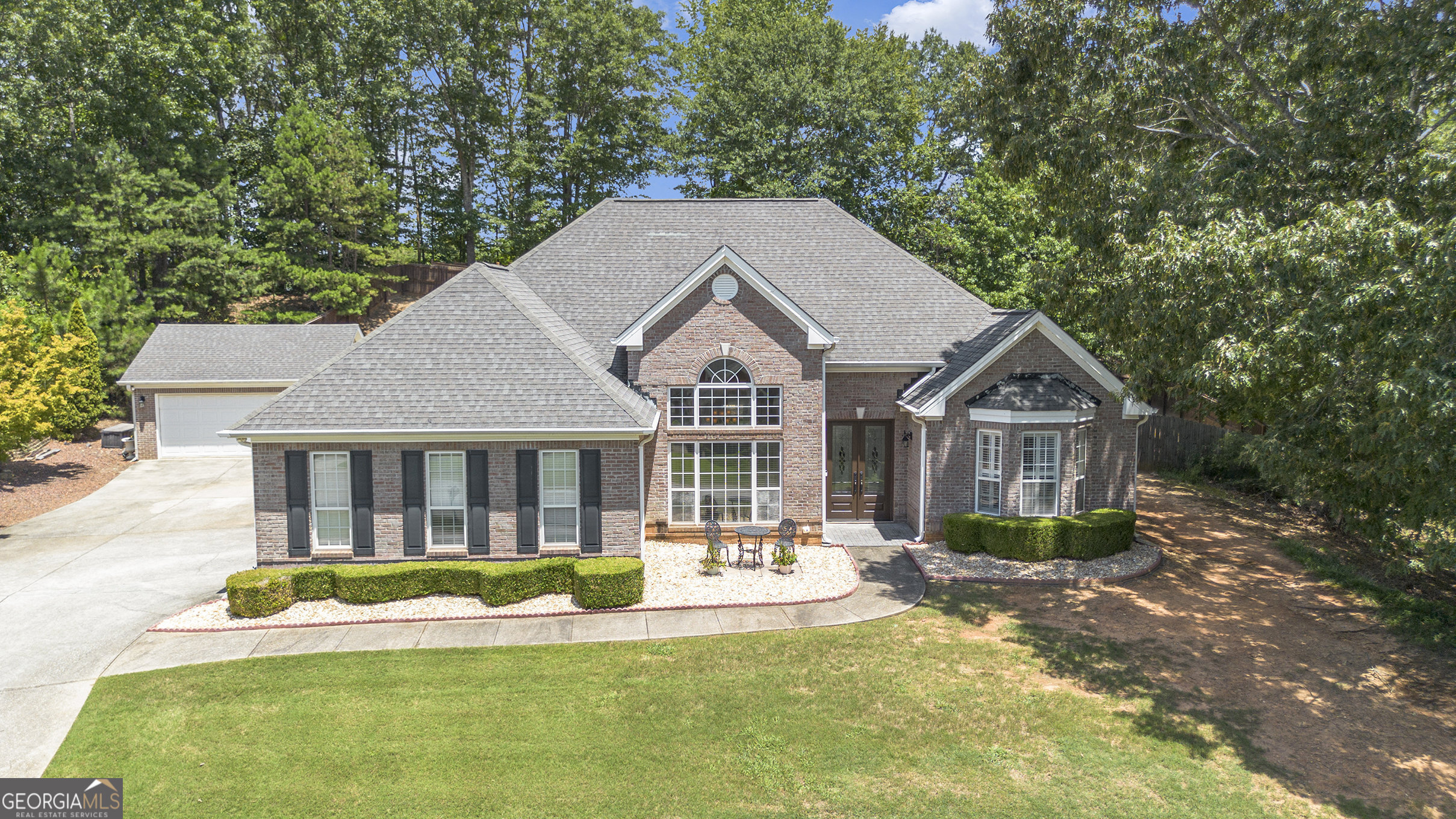 Welcome to 606 Gold Crest Drive, Braselton, GA! This beautifully updated 3-bedroom, 2-bath brick-front ranch is an absolute showstopper-you're going to fall in love! Step inside to discover a spacious and inviting floor plan, including an oversized primary suite with a breathtaking bathroom retreat. The luxurious primary bath features separate his-and-hers vanities, a stunning walk-in shower, and a soaking tub perfect for relaxing at the end of the day. Designed with comfort and privacy in mind, this ranch-style home features a roommate floor plan with two generously sized secondary bedrooms located on the opposite side of the home. The formal dining room is a true centerpiece, ideal for hosting family gatherings and special occasions. The cozy family room is warm and inviting, highlighted by a redesigned fireplace that adds a modern touch. The kitchen offers a bright breakfast area overlooking your private backyard oasis-complete with a beautiful saltwater pool that's perfect for entertaining family and friends all year round. This home is truly move-in ready and full of charm. Don't miss your chance-this gem won't stay on the market for long. Thank you for showing!