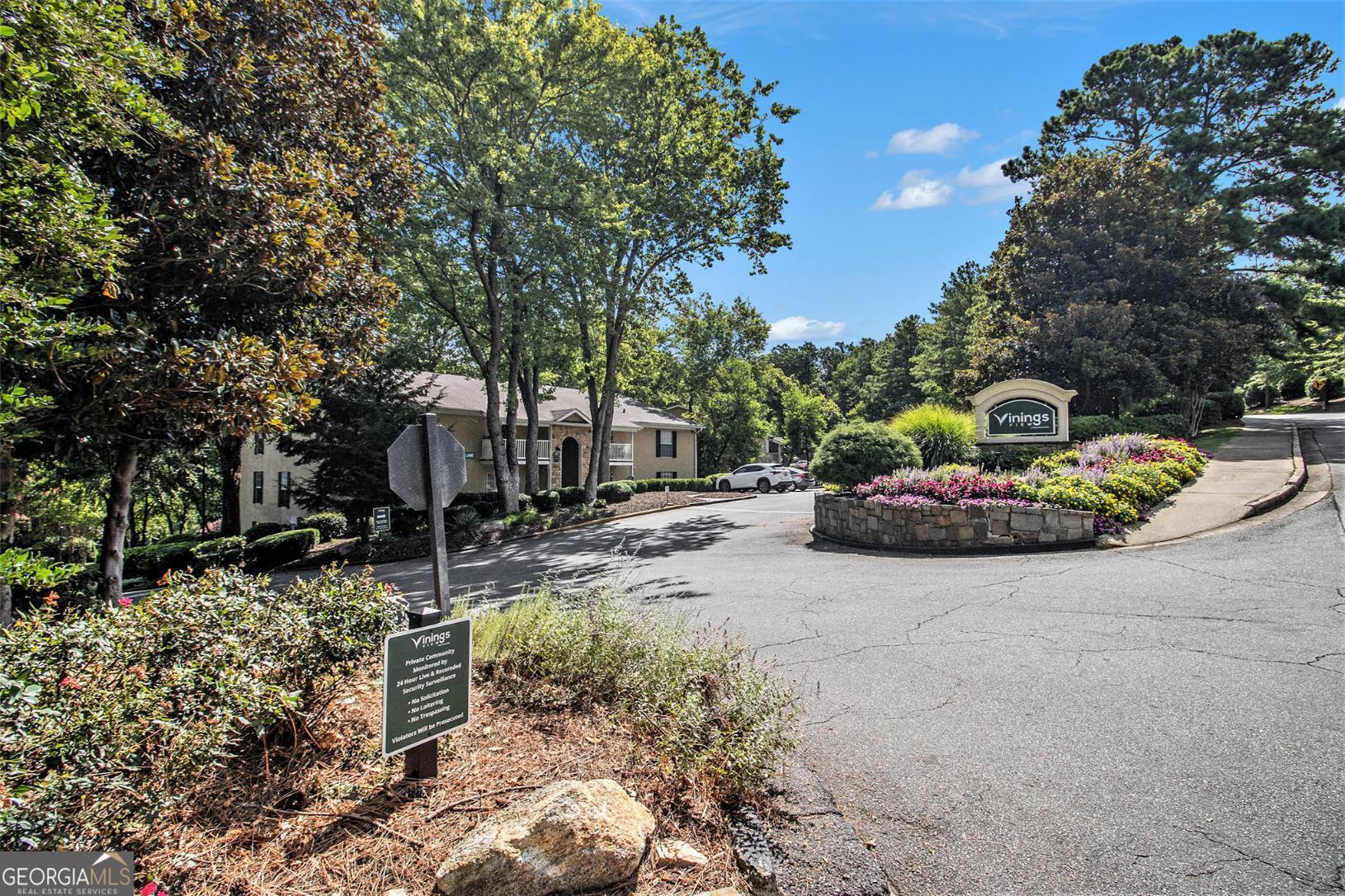 Welcome home to this move-in ready 2-bedroom, 2-bathroom condo in the heart of Vinings! Enjoy peace of mind with a brand new HVAC system, new hot water heater, and fresh paint, plus low-maintenance living in a sought-after community. The home features a spacious, open layout with generously sized bedrooms-each offering ample closet space and natural light. The kitchen is a standout with stained wood cabinetry, granite countertops, and a large dining area, perfect for entertaining or everyday living. Step out onto your private balcony and take in amazing views of The Battery and Truist Park. Just minutes from shopping, dining, I-285, and all the excitement of Braves games and concerts-this is city living at its best!
