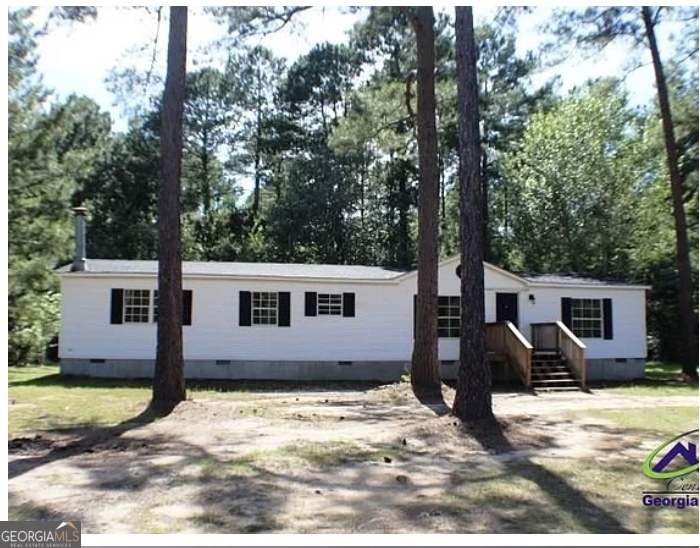 Charming 3 bedroom and 2 bathroom mobile home on one acre of land in the county. Move-in ready and beautifully updated, this 3 bedroom, 2 bathroom mobile home offers modern comfort in a peaceful county setting. Renovations include a new HVAC system, new roof, new hot water heater, new kitchen appliances, new flooring, and new light fixtures throughout. Situated on 1 acre with no HOA, this property provides privacy as well as space for gardening, outdoor fun, or adding a workshop. Located in the West Laurens School District, just minutes from Dublin and major highways.