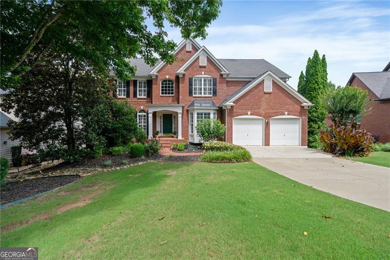 Beautiful home in a sought-after community with top-rated schools and incredible amenities including a lake, pool, tennis and pickleball courts, playground, and active swim and tennis teams. This light-filled home features hardwood floors throughout, a spacious dining room, flex room, guest bedroom with full bath, and a renovated chef?s kitchen with large island, updated appliances, and stove vented to the outside. The kitchen opens to a stunning two-story family room?ideal for entertaining. Upstairs, the primary suite offers peaceful lake views and a spa-like bath, along with three additional bedrooms and two full baths. The full, partially finished basement includes a TV room, bedroom, and full kitchen perfect for guests or multi-generational living. Enjoy lake views from the deck or patio, with private stair access to the water for fishing or launching a kayak. Garage includes an electric car charger. This home offers the perfect mix of space, style, and community lifestyle.