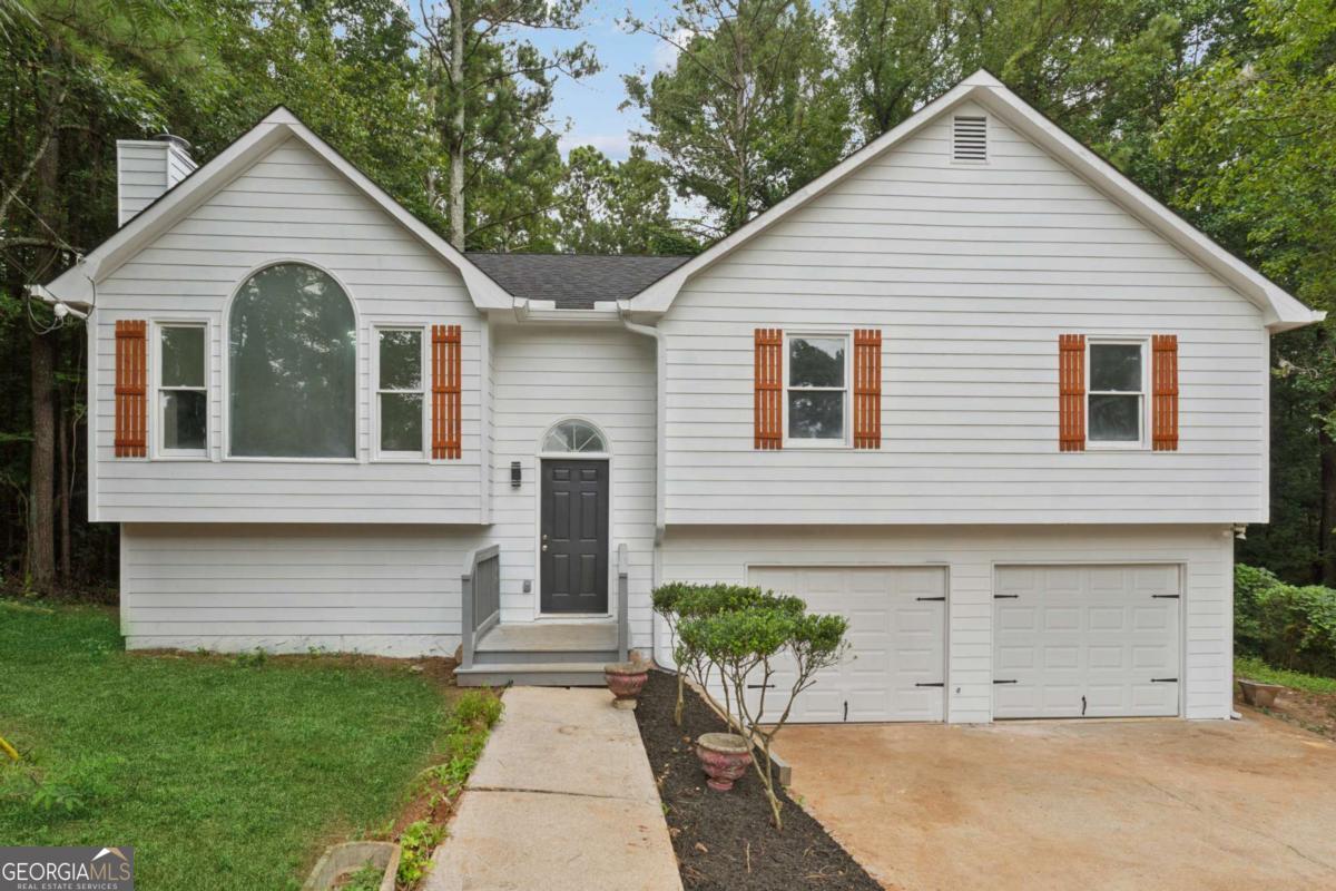 Home. Sweet. HOME! This 4-bedroom, 3-bath home in a renovated split-level style home. Offers a practical and flexible layout. The main level features a comfortable living room with a wood-burning fireplace and an efficient kitchen with a direct view of the great room. The primary suite includes a private bath and private closet, with two additional bedrooms and a full bath nearby. The finished basement provides even more functional space, including a fourth bedroom, a third full bath, and a bonus room. Whether used as a private in-law suite, guest space, or home office, the basement. This home delivers great value and versatility in a convenient location.