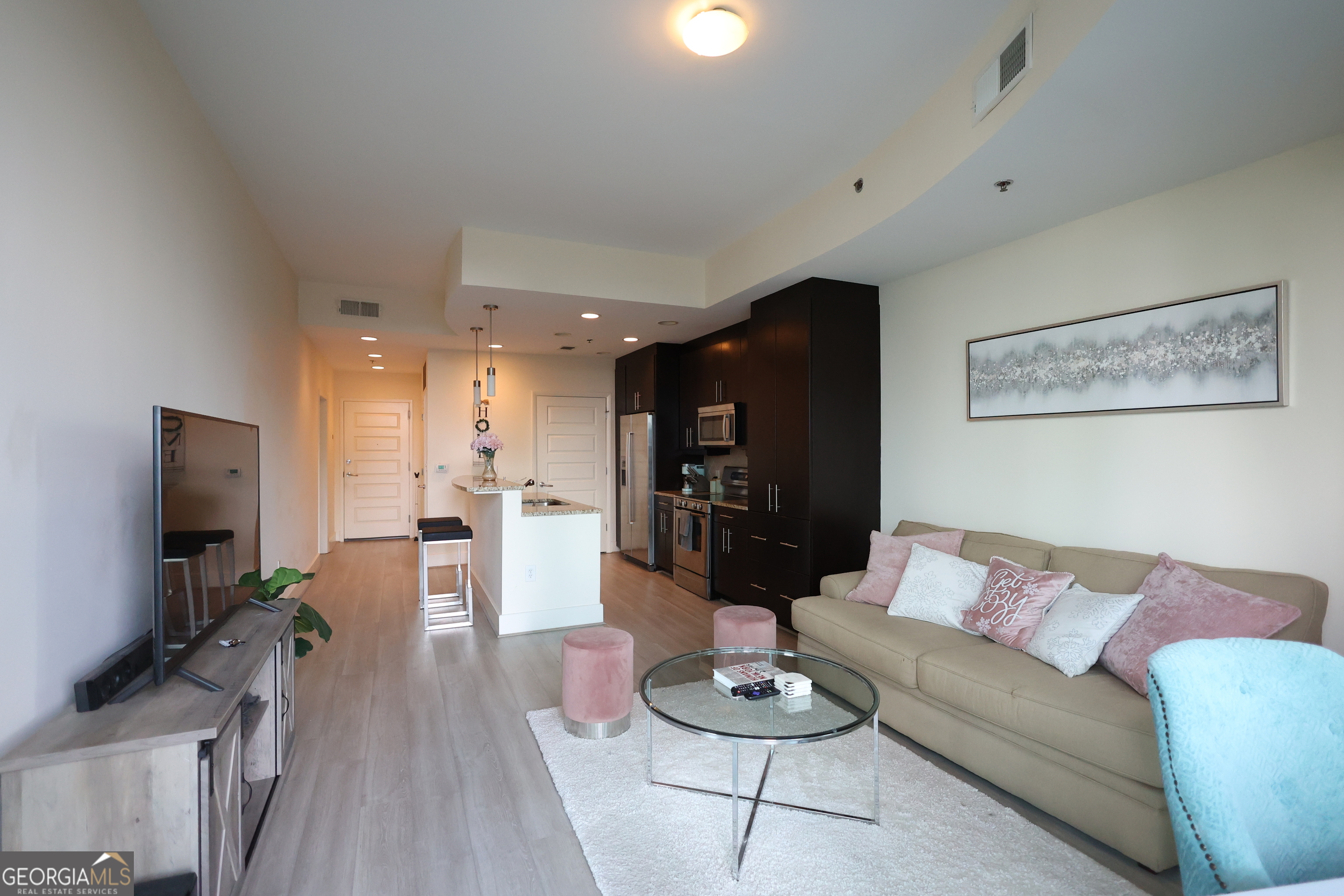 Your sun drenched one bedroom with great views in 1010 Midtown awaits! This 10th floor unit looks directly down Peachtree St and includes a rare storage room and premium parking space. Complete with floor to ceiling windows which bring the outside in, this unit feels spacious and bright. The kitchen opens to the living space and stainless appliances, granite counters, and stained cabinets with great storage. 1010 Midtown offers some of the best amenities with a south facing pool deck, clubrooms for your enjoyment, and large fitness rooms. Perfectly located in Midtown and walking distance to Piedmont Park, MARTA, the Beltline, Colony Square, and more!