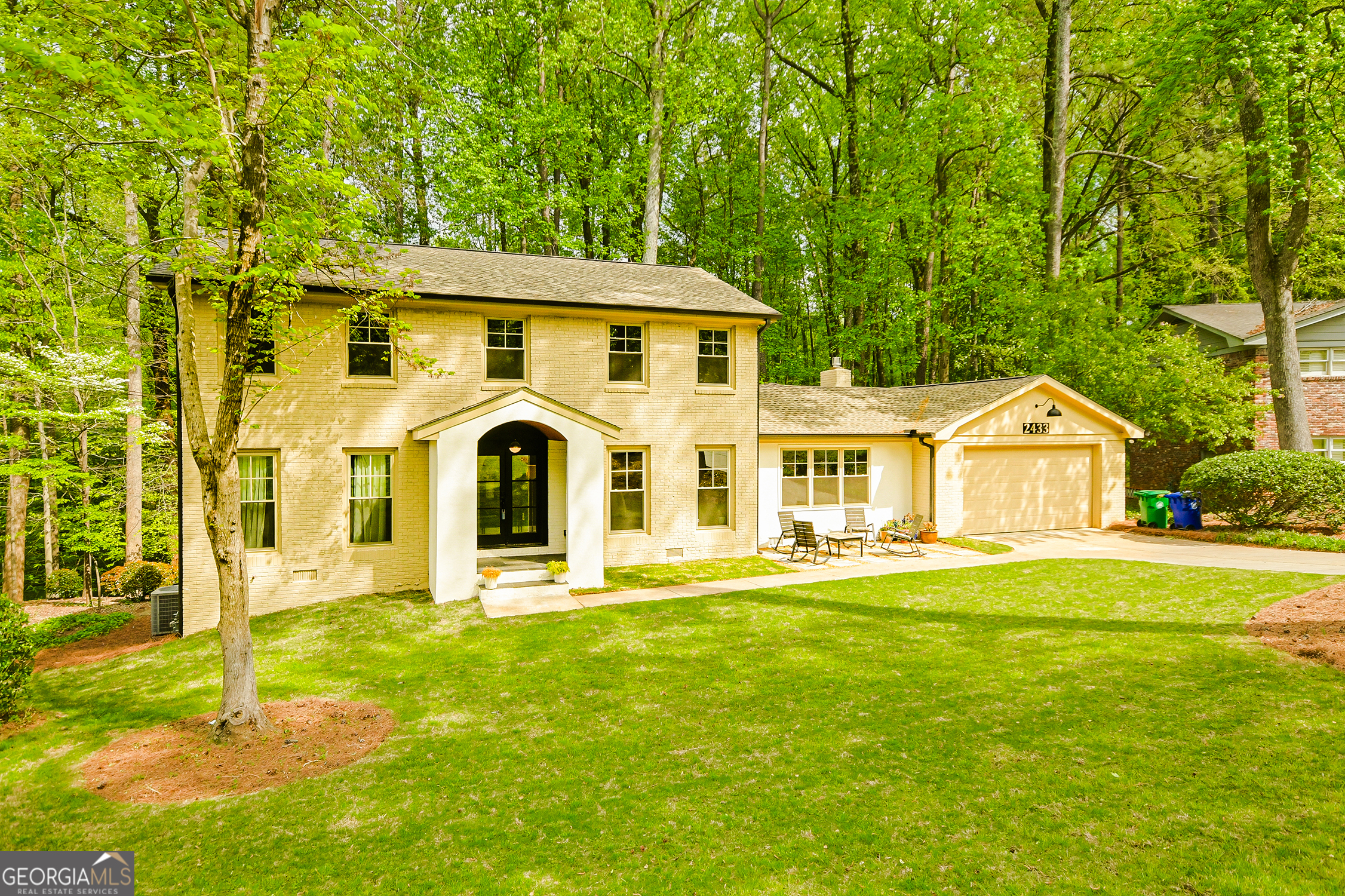Fully Renovated 6BR/4.5BA with Terrace-Level In-Law Suite & Stunning Sunroom Inside the Perimeter. This beautifully reimagined home offers nearly 3,700 sq ft of stylish, move-in-ready living across three finished levels. The main level features a designer kitchen with premium finishes that opens to an inviting living room with a gas brick fireplace. From there, step into the expansive sunroom-lined with windows on all sides and four skylights-a light-filled space perfect for entertaining or relaxing as you overlook the wooded backyard. The primary suite on the main includes a spa-style bath and its own laundry hookup for convenience. Upstairs offers four spacious bedrooms, two renovated bathrooms, and a second laundry area. The finished terrace level features a 1BR/1BA suite with private entry, perfect for guests, in-laws, or rental potential. Situated inside the perimeter, this location provides quick access to Emory University, CHOA, Midtown, Buckhead, and major interstates. Nearby top-tier private schools like The Paideia School and The Galloway School add to the appeal. With a brand-new roof, updated systems, and timeless architectural charm, this home delivers space, style, and an unbeatable ITP location.