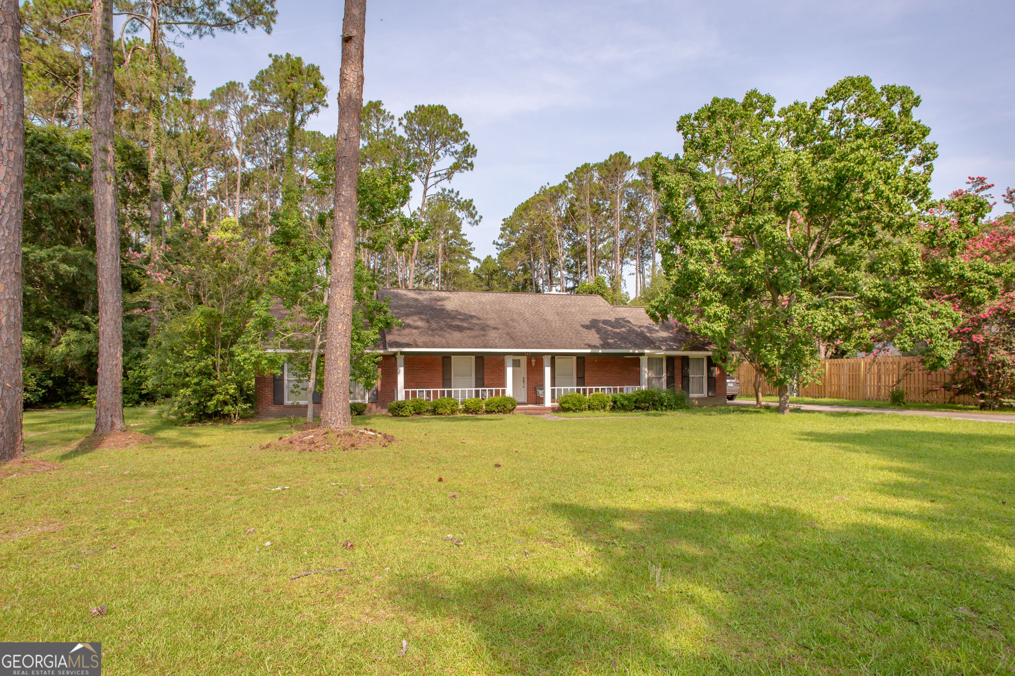 Welcome to 763 Kentland Drive! This spacious 3-bedroom, 2-bathroom brick home offers 2,087 sq. ft. of comfortable living space on a peaceful .53-acre lot. Step inside and you'll find two inviting family rooms, perfect for entertaining or creating separate living spaces. A cozy fireplace adds warmth and character, making it a great spot to relax on cooler evenings. The home also features a double carport, providing covered parking and easy access. Outside, the large yard offers plenty of room for outdoor activities, gardening, or simply enjoying the quiet setting. Located in a tranquil neighborhood, this home combines privacy with convenience-close to local schools, shopping, and dining in Waycross. Don't miss the opportunity to make this beautiful property your own!