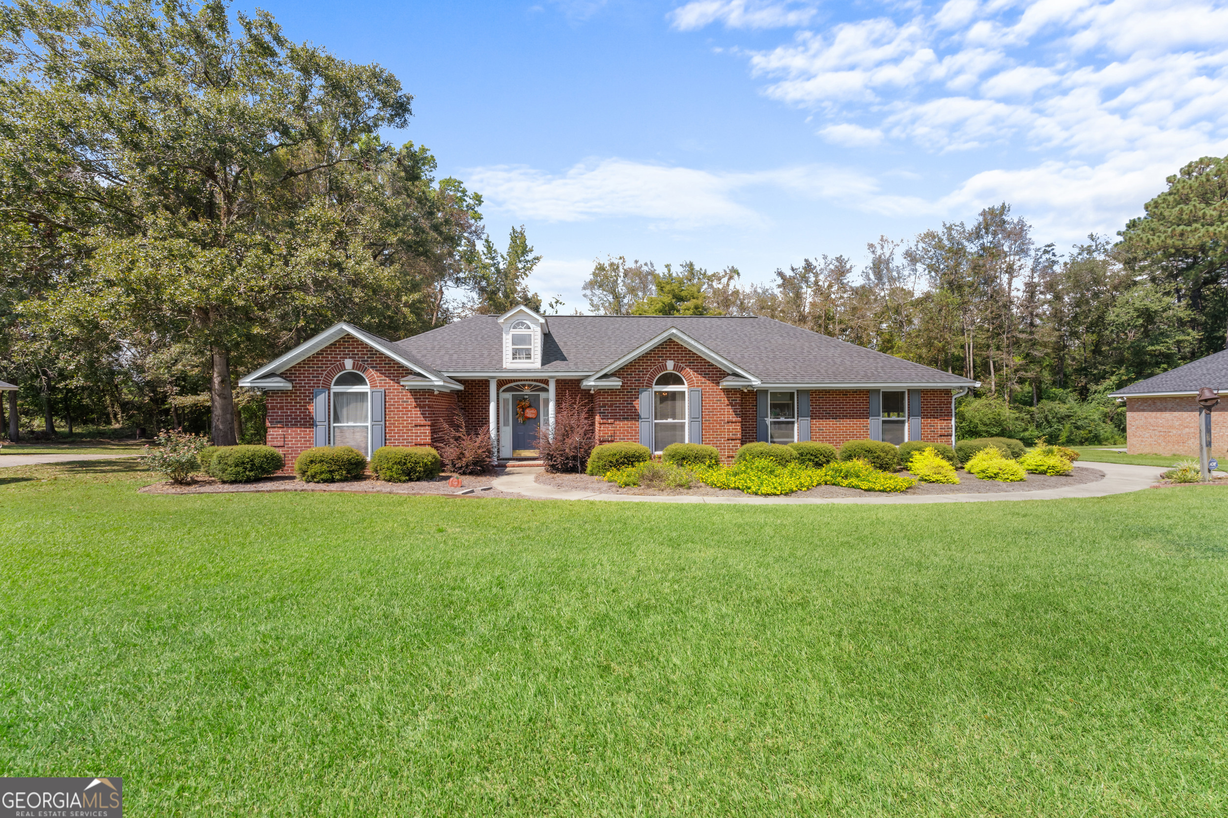 Charming 3 bedroom, 2 bath brick home in the desirable Bradford Place subdivision! Situated on a spacious .68 acre lot, this property is convenient to restaurants and shopping yet tucked away in a quiet neighborhood. The inside offers a split floor plan featuring a master suite with double closets, a garden tub, separate shower, and double vanities! The open living room has vaulted ceilings and a gas fireplace, plus there is an eat-in kitchen AND formal dining room ideal for everyday living and entertaining! There is also a 2-car garage, a separate laundry room with cabinetry, and a full storage room that could easily be a home office with access directly from the outside! Don't let this one slip away. Call today for your private tour!