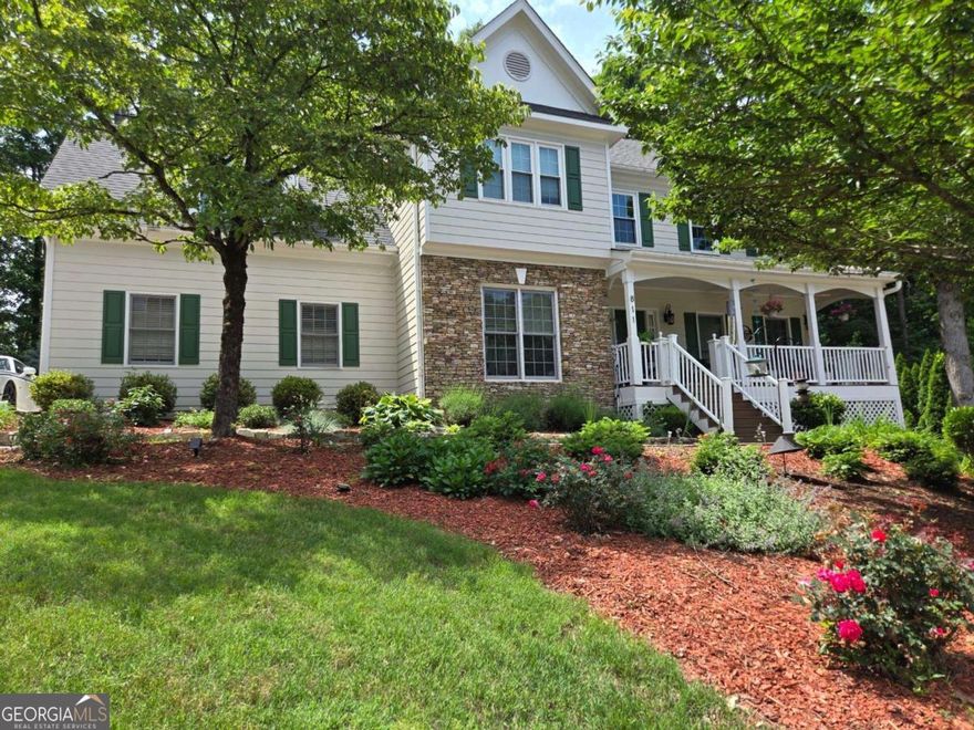 COMING SOON in Flowers Crossing at the Mill - Brookwood School District! Tucked away on a quiet cul-de-sac in the highly sought-after Flowers Crossing at the Mill community, this beautifully maintained 5-bedroom, 2.5-bath home is a must-see. From the moment you arrive, you're welcomed by a charming front porch-perfect for unwinding with a good book or enjoying a peaceful evening breeze. Step inside to discover an expansive main level with oversized living and dining spaces ideal for entertaining. The white kitchen shines with granite countertops, stainless steel appliances, and plenty of cabinet space. Upstairs, you'll find generously sized secondary bedrooms and a spacious primary suite with a large ensuite bath. The partially finished basement offers a versatile bonus room and an additional bedroom-great for guests, a home office, or teen retreat. Out back, the professionally landscaped, fenced-in yard features a full irrigation system and provides a beautiful, private setting for outdoor living. Located in a swim/tennis community with access to top-rated Brookwood schools, this home is super clean, move-in ready, and loaded with updates.